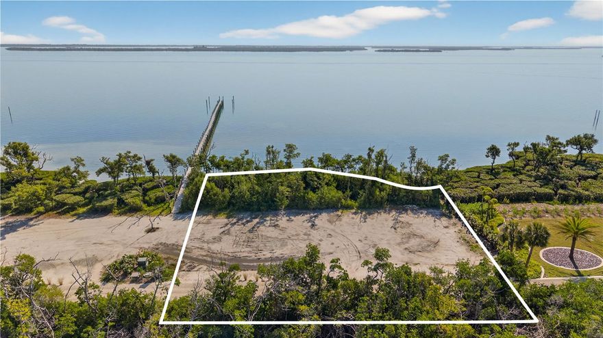 This oversized lot 440 in the Collier Preserve section of Useppa Island boasts 150 feet of water frontage on Pine Island Sound. Sharing a 2-slip dock with the adjacent owner, soo the boating life is conveniently at your doorstep. Useppa Island Club and Marina is a private community and members-only club. With no need for gates or walls, it is surrounded by water, in the pristine Pine Island Sound and Charlotte Harbor aquatic preserves. Geographically it is in the same chain of barrier islands as Sanibel-Captiva, visible to the south, although one island east of the Gulf. Accessible only by boat (or aircraft), the commute to the mainland is in a special class of its own. Just a 15-minute joyful boat ride will deliver you to Boca Grande or Pine Island, and thence to all “civilized” conveniences of the mainland. The commute is special in a way that you will never tire of it. Just think-you are not stuck in traffic, or waiting for a light to change, fretting over the packed roads ahead. You are just watching the dolphins play and the birds dive, waving to passing boats with smiling passengers. Yes, not like the mainland! You might be sitting next to one of your Useppa neighbors, who has all their goods delivered to the Shore Port, where the staff will transport them to the island, and her home. Who said it is inconvenient when you don’t have roads? And this beautiful lot will let you build the house of your dreams and join the ranks of the smart and lucky who have already landed on Useppa as a lifestyle choice.