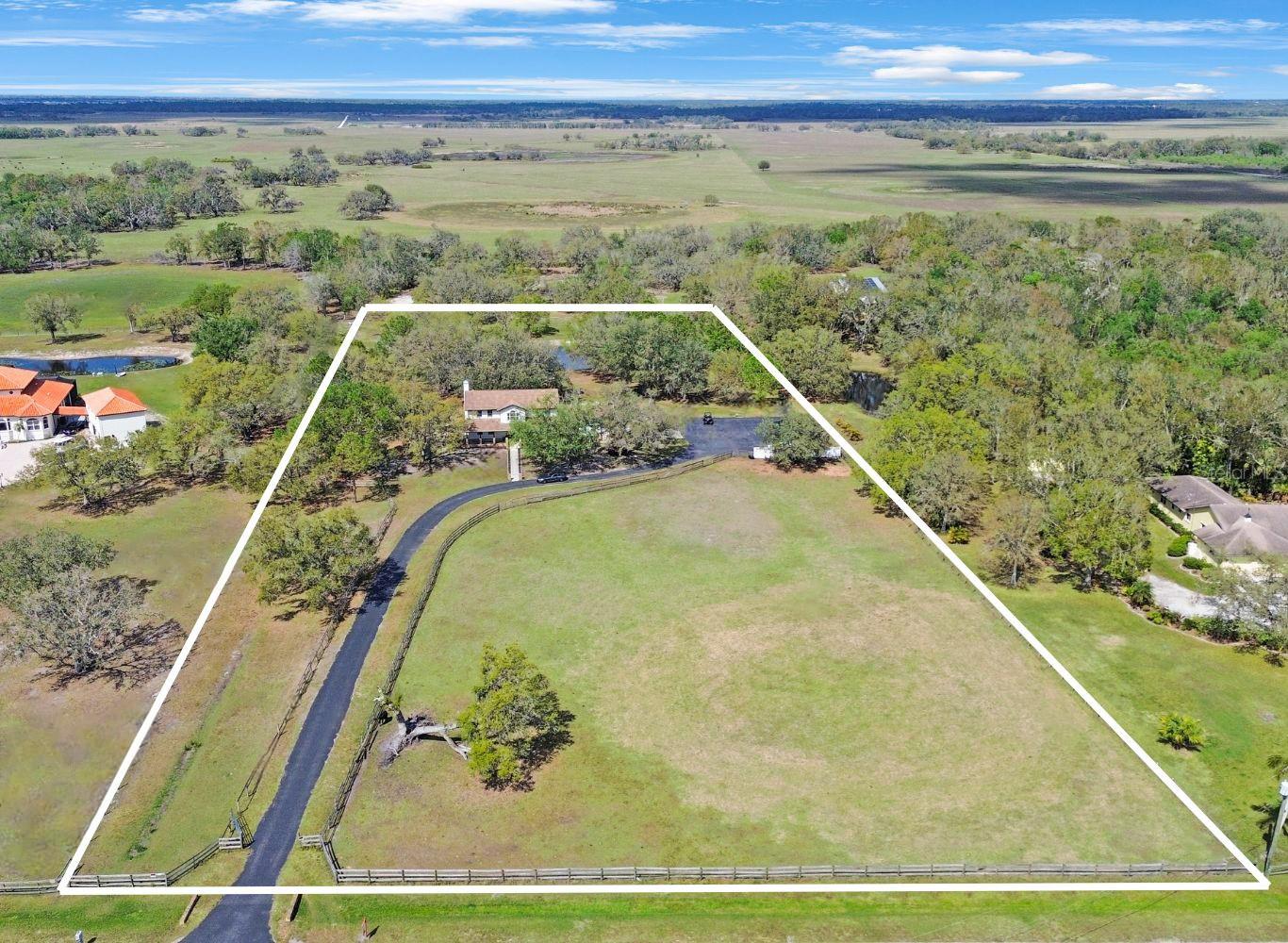 Fully Renovated 5-Acre Homestead in Bern Creek Ranches, Sarasota County
Nestled on 5 acres of lush land, this stunning homestead ranch offers privacy, luxury, and endless possibilities. The property is fully renovated from top to bottom, blending modern amenities with country charm. Located in the highly desirable Bern Creek Ranches community, which is pet and livestock-friendly, this is the perfect home for those seeking a peaceful, rural lifestyle with ample space for animals and outdoor activities.
Key Features:
A large, deep pool with an attached hot tub, all screened-in for year-round enjoyment.
Private pond in the backyard, adding a serene and tranquil atmosphere.
Outdoor BBQ/kitchen gazebo, perfect for entertaining family and friends.
Spacious 1.5-acre front pasture and an additional 2nd front pasture, ideal for grazing livestock or recreational use.
A 2-car garage, expansive paved parking pad, and a long, private driveway with a gated entrance, providing both convenience and privacy.
The list of renovations is too long to list, so come and see it in person to truly appreciate the attention to detail and craftsmanship. The community also allows for up to 3 total structures to be built, offering flexibility for future expansion, such as an additional garage, barn, or detached mother-in-law house.
Whether you’re looking for a peaceful retreat, space for your pets and livestock, or room to grow, this property offers the ideal balance of privacy, convenience, and opportunity. Don't miss the chance to own this incredible piece of Sarasota County paradise!