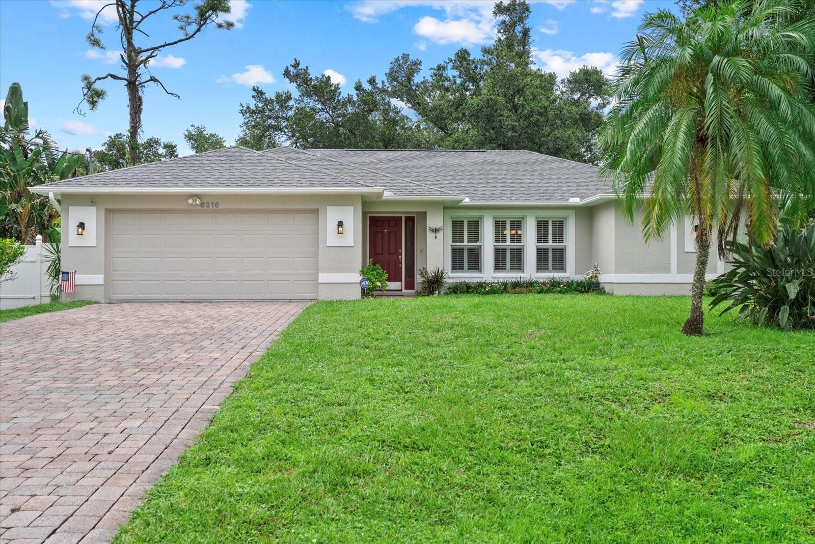 Peace of mind meets Florida living in this beautifully maintained 3-bedroom, 2-bath North Port home with a new roof (2022) and a brand-new AC system (8/27/2025). Enjoy vaulted ceilings and a desirable split-floor plan with both a living room and a family room, offering plenty of space for entertaining and everyday living. The kitchen shines with stainless steel appliances, breakfast bar seating, and open flow to the dining and family areas. The private primary suite features a walk-in closet and a spacious en-suite bath, along with direct lanai access. Step outside to a fenced backyard oasis with mature trees and landscaping — perfect for relaxing, entertaining, or gardening. Additional highlights include public water service, a dedicated laundry room, two-car garage, and Flood Zone X location for added security. With no HOA or CDD fees, and close to shopping, dining, schools, parks, and Gulf beaches, this home combines comfort, updates, and lifestyle all in one.