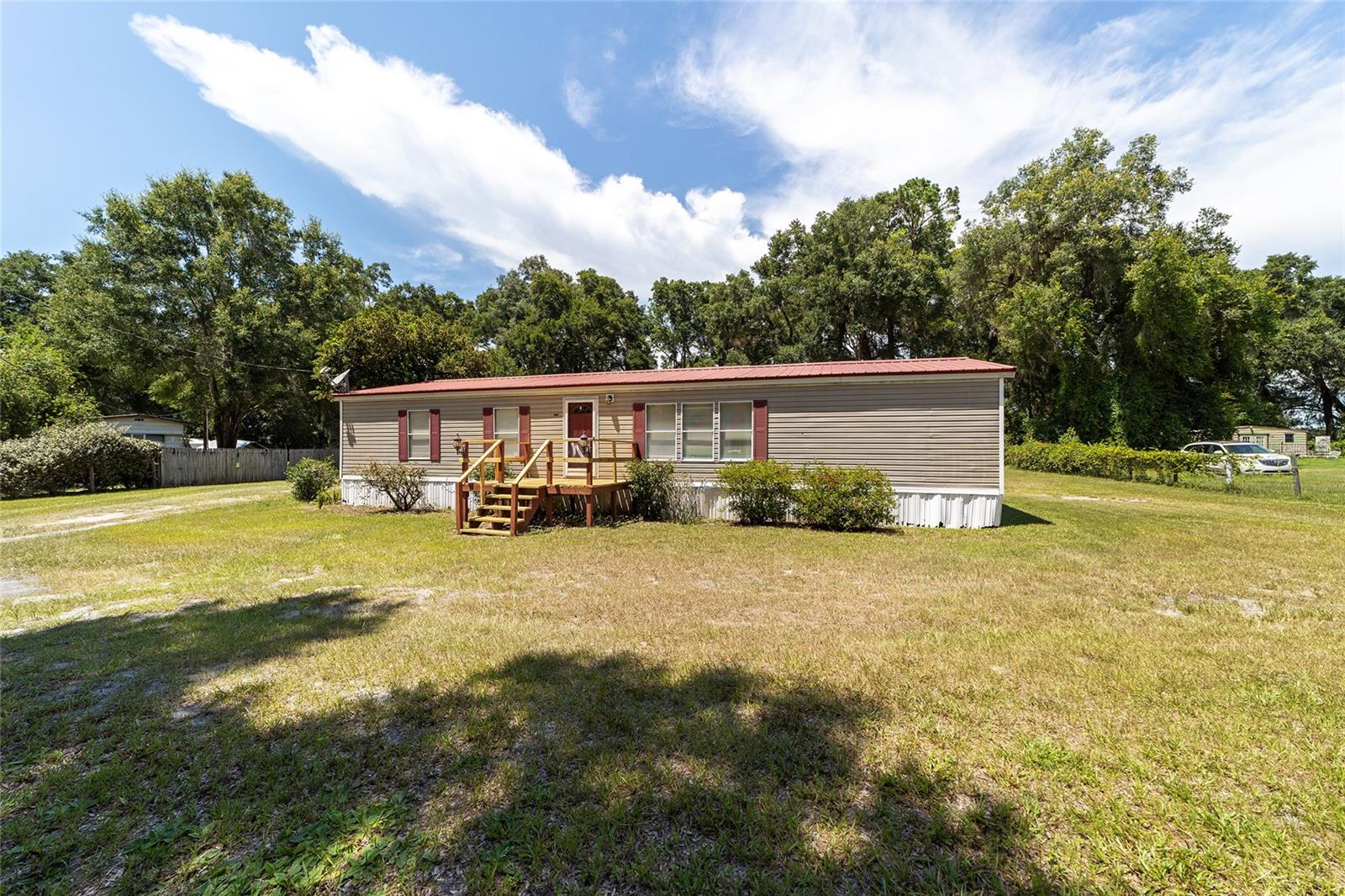 Welcome to this beautifully UPDATED manufactured home in Summerfield, 3 bedrooms plus a versatile bonus room, 2 bathrooms, and 1,344 sq ft of comfortable living space. The open, split floor plan provides both functionality and privacy — perfect for families or entertaining guests.
Enjoy a fully remodeled kitchen with ample cabinet space and stylish finishes, complemented by brand new luxury vinyl plank flooring throughout. Recent upgrades include a newer HVAC system and a durable metal roof for long-term peace of mind.
Step outside to a gorgeous back porch overlooking the expansive backyard — the perfect spot to relax with a morning coffee or host outdoor gatherings. Sitting on a generous 1-acre lot, there’s plenty of room to enjoy the outdoors in comfort and privacy.
At an unbeatable price, this move-in-ready home is truly priced to sell — don’t miss your chance to own a piece of Summerfield!
