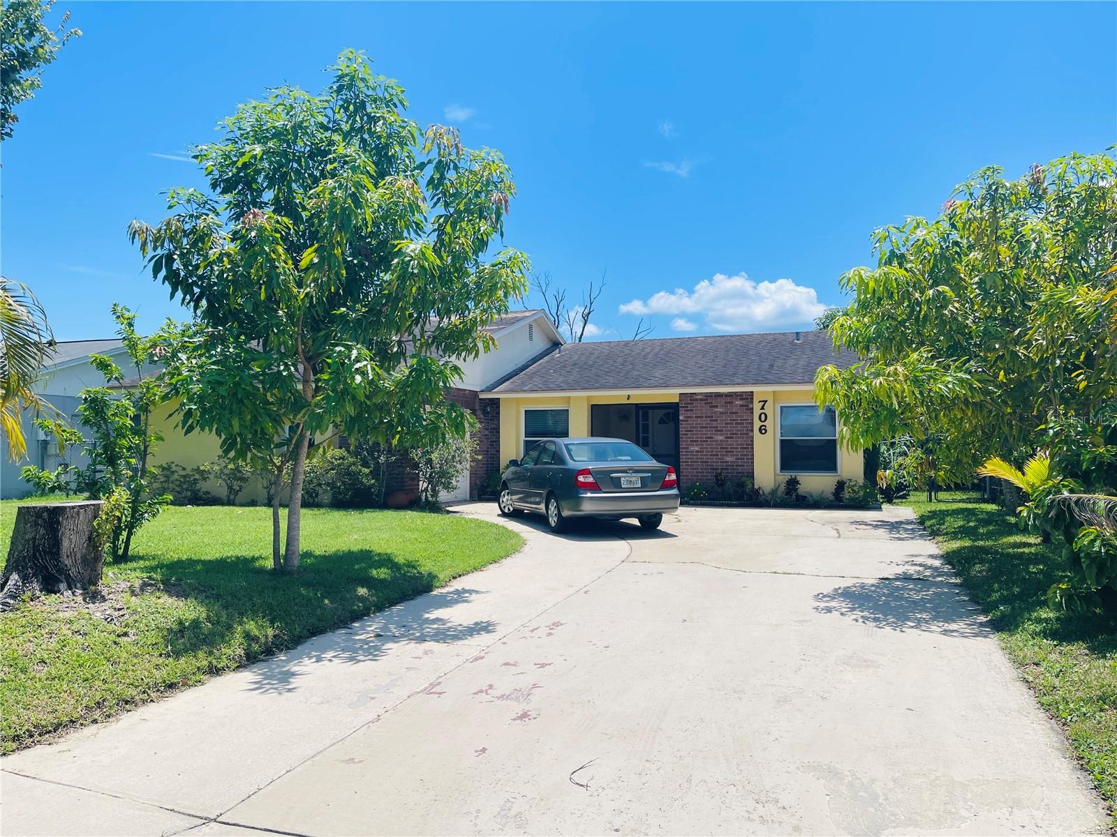 Welcome to 706 Wedge Ln – a charming 3-bedroom, 2-bathroom single-family home nestled in a quiet Kissimmee neighborhood. This property sits on a spacious lot featuring a beautifully landscaped backyard with mature fruit trees, lush plants, and plenty of room to relax or entertain outdoors. A detached work shed adds functionality and storage, perfect for hobbies, tools, or a workshop. Inside, the home offers a comfortable layout with a bright living area, a well-appointed kitchen, and generously sized bedrooms. With its inviting outdoor space and practical features, this property is ideal for those who enjoy both indoor comfort and outdoor living. Don’t miss the opportunity to make this home yours!