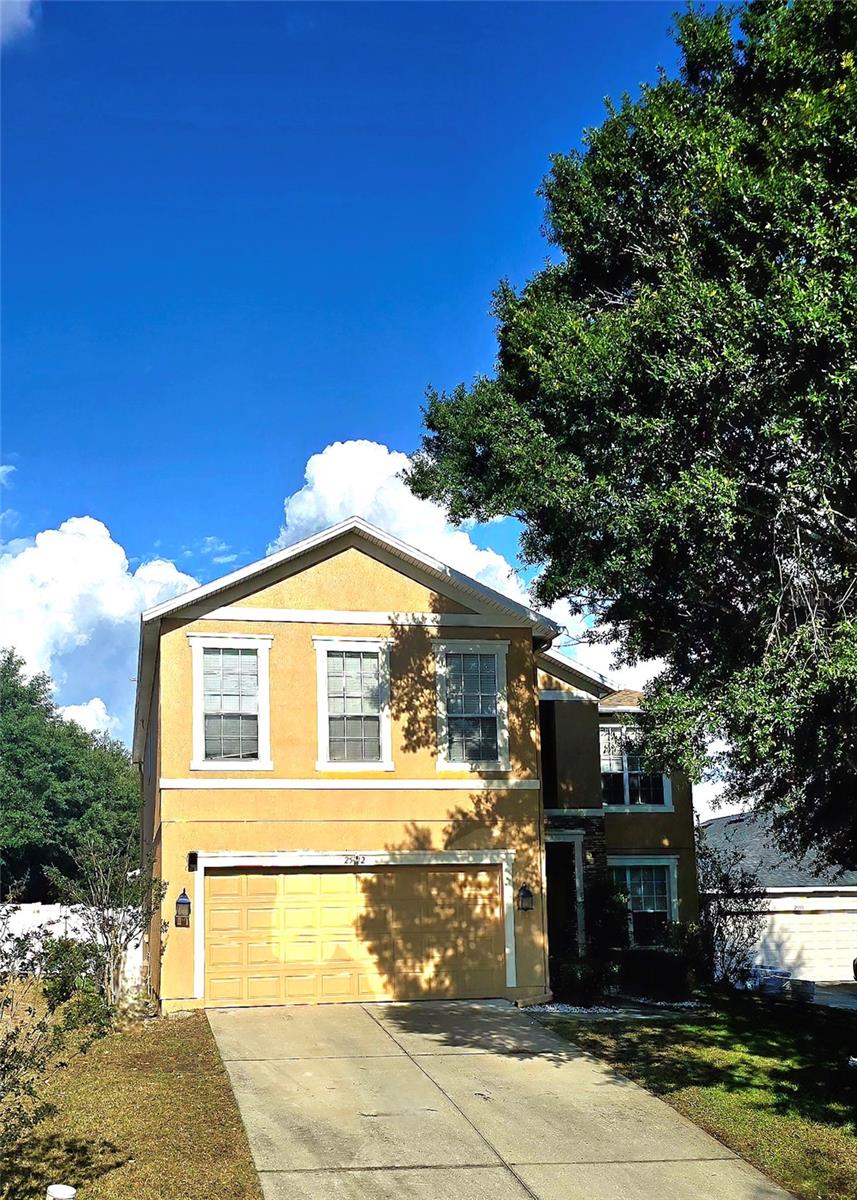 Welcome home! This spacious residence features four bedrooms, two and a half bathrooms, and a fifth room that could be an office or substitute as a bedroom. Situated on a tucked away cul-de-sac with nearly a quarter acre of land (0.23 acres). Noteworthy updates include a brand - NEW roof, NEW luxury vinyl flooring, and a freshly painted exterior. The larger a/c is about 3 years old, and the upstairs unit was replaced in October 2024. Upon entering, you will be greeted by the luxury vinyl flooring that extends seamlessly throughout the home, fostering a cohesive atmosphere. Host gatherings in the formal living and dining rooms or relax in the inviting family room. The expansive eat-in kitchen is perfect for culinary endeavors, offering ample cabinetry for storage and a lovely view of the backyard. The office or den provides a private space conducive to completing work, academic tasks or catching up on your favorite book. Upstairs, you will find a generous sized bonus/flex room, ideal for various uses. The primary bedroom serves as a private retreat, complete with an ensuite bathroom featuring dual sinks, a large walk-in shower, and a walk-in closet. Three additional well-proportioned bedrooms accommodate all your needs. The utility room is conveniently located on the second floor, simplifying household chores. This home also boasts elegant design features, including archways and niches. Step outside to the oversized backyard, complete with a covered patio and vinyl fence. Love where you live with nearby natural parks with sought after springs, trails and nearby access to 429 and 46 to get around town. Within minutes of Apopka or Mt. Dora. Don’t miss out on this great home, call today for a showing! Owner financing may be considered