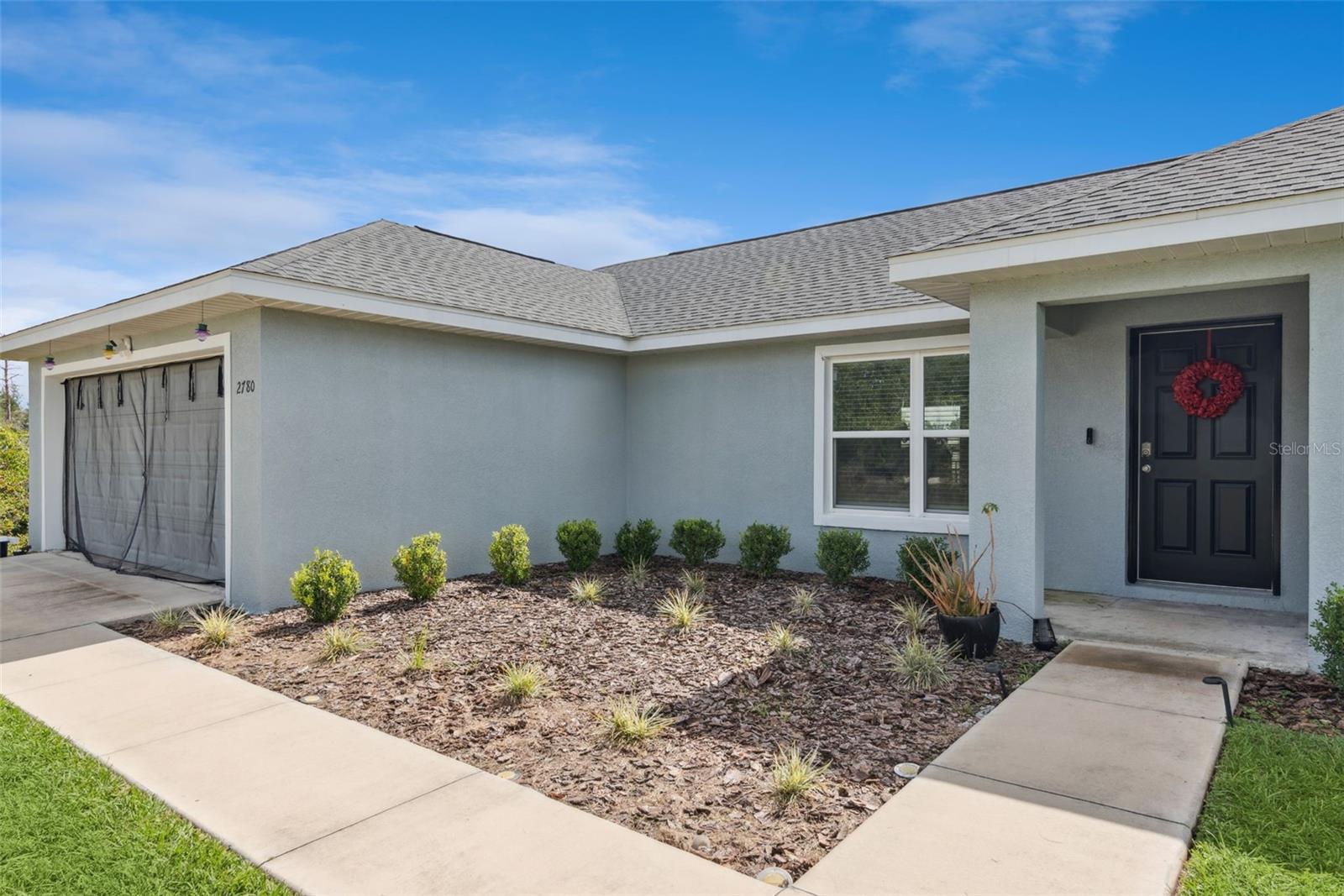 Welcome to 2780 SW 161st Ln, a beautifully designed 3-bedroom, 2-bath home located in the desirable Marion Oaks community of Ocala, Florida. Built in 2022, this modern home blends contemporary finishes with comfortable, open-concept living.
Step inside to a bright and spacious open floor plan with high ceilings and luxury vinyl flooring throughout — no carpet! The split-bedroom layout provides privacy for the primary suite, while the main living area offers seamless flow between the kitchen, dining, and living spaces.
The kitchen features rich dark cabinetry, modern fixtures, and ample counter space, perfect for both everyday living and entertaining.
Outside, enjoy the freedom and space of a .4-acre lot, offering plenty of room for a garden, outdoor activities, or future additions.