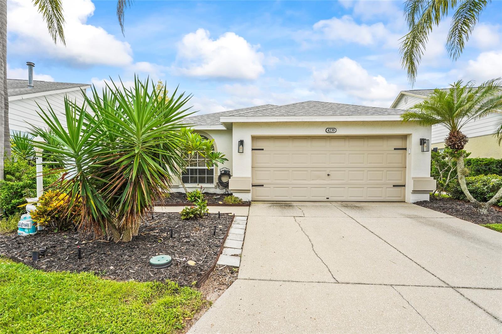 Set in the tranquil Treetops community, where low HOA fees include cable, internet, a pool, and tennis court, this single-story 3-bedroom, 2-bath home with a 2-car garage blends comfort with convenience. Inside, vaulted ceilings, recessed lighting, and ceiling fans create an airy atmosphere. The bathrooms feature freshly painted cabinets and newer plumbing fixtures, while the garage has been upgraded with durable epoxy flooring. Recent improvements include a roof replaced in 2020, HVAC in 2018, and a new washing machine in 2025—ensuring peace of mind for years to come. The screened lanai offers serene pond views and leads to a backyard designed for both privacy and relaxation. A new fence with backyard access, fresh landscaping, and a new sprinkler system make outdoor living effortless, while a newly installed lanai screen completes the move-in ready appeal. Centrally located in Sarasota, this home is minutes from Sarasota/Bradenton International Airport, University Town Center Mall with over 100 shops and dining options, golf courses, cultural and culinary hotspots downtown, and the world-famous Gulf Coast beaches. For added convenience, furnishings are also available separately, offering buyers a turnkey option.