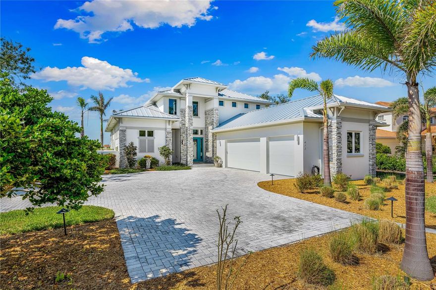 This stunning coastal waterfront estate is a fishing and boaters' dream. This property promises the sought-after Florida sunsets night after night! This private oasis sits on .65 acre and establishes security with a private solar powered gate. Walking into the foyer you experience the open floor plan with a linear gas fireplace in the great room, and high end finishes throughout. Pocket sliders line the great room, kitchen, and owner’s suite, with breathtaking views of the intracoastal that provides an abundance of natural light! The flow from the kitchen to the great room provides functionality for everyday living or entertaining. The kitchen provides stainless steel Thermador wifi-compatible appliances, a convection double oven, glass induction cooktop, microwave drawer, and an oversized refrigerator with two ice makers! It is also fitted with Italian tile backsplash! The Owners' suite is conveniently located on the first floor with the same beautiful views, a large shower, and a favorable walk-in closet. Other features of this spectacular home include a Sonos sound system, and an elevator to the 2nd floor. The elevator opens up to a loft and three additional bedrooms. Two of the three bedrooms include ensuites with a private patio and breathtaking views to the North and South of the intracoastal waterway. The 3rd bedroom shares the public bathroom. Once outside there is a spacious lanai with a fully equipped outdoor kitchen, including seating versatility for dining, watching your favorite tv programs, and entertaining. The lanai is also equipped with a linear gas fireplace, powered sun and storm shades, and a Sonos sound system. After a short walk down to the dock you will find easy access to a 10,000 lb boat lift with remote control operation. There is electric and a fresh water source for convenient fish and boat cleaning.  Just 1.1 miles from Nokomis Beach, this estate allows for a quiet and private lifestyle and is within a short drive to vibrant downtown Venice and Sarasota. Don’t miss out on your chance for Coastal living!

*Dont forget to click the virtual link*

*This is turnkey optional*