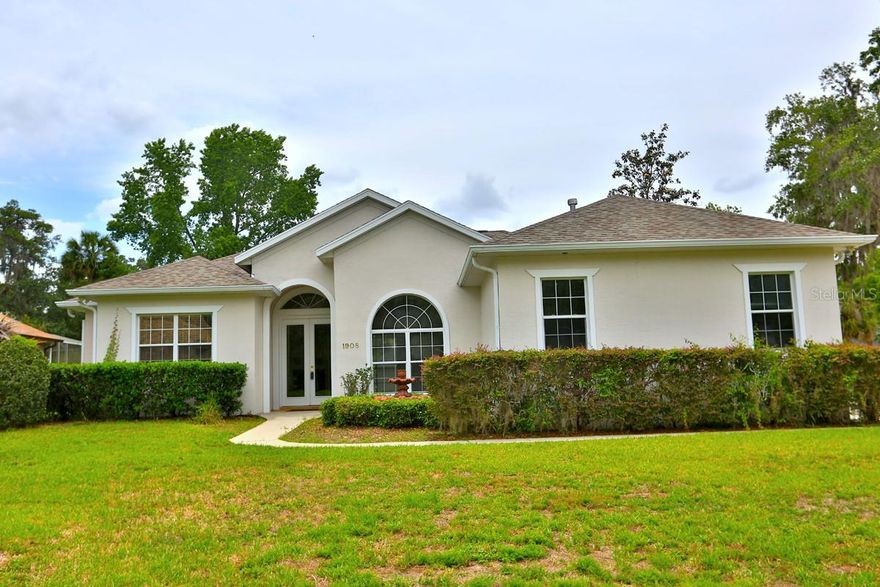This charming 4-bedroom, 2-bathroom pool home is conveniently located in the White Oak Village Community, near shopping, restaurants, and medical facilities. Upon entering, you are welcomed by an open floor plan. The family room features a fireplace, tile floors, and sliding glass doors that lead to a screened-in pool area. The formal dining room boasts hardwood floors and a recessed ceiling adorned with a chandelier. The kitchen is equipped with raised countertops that provide seating, a pantry, and spacious cabinets. The owner's suite includes an ensuite bathroom, while the additional three bedrooms are located on the opposite side of the home. Situated on a corner lot, this property features a circular driveway for easy access and ample parking for family and friends. Residents can enjoy the amenities offered at the White Oak Village Community Center, which includes a clubhouse, pool, tennis courts, fitness center, sauna, racquetball, shuffleboard, and banquet rooms.