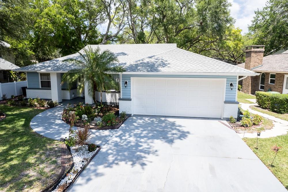 Situated in a well maintained and established community; this beautiful home provides its community members with a low maintenance lifestyle. Arbor Oaks is a NON-AGE RESTRICTED HOA community. The HOA includes cable, internet, exterior lawn maintenance, community pool maintenance, and even irrigation maintenance! This gorgeous home is just steps away from the community swimming pool. Just 7 miles from the beautiful beaches of Anna Maria Island. Nearby to numerous shopping centers, dining, and entertainment. This location highlights the beauty that Bradenton, Florida has to offer. The interior of the home has been tastefully updated with a brand new gourmet kitchen equipped with a pot filler, built-in spice rack and built in oven, a brand new stainless steel appliance package, new all-wood, soft close cabinets, and gorgeous Level 5 Calacatta quartz countertops (all installed 04/2024). The entire flooring throughout the home has been replaced with modern wood-plank tile. NO CARPET ANYWHERE! NEW ROOF! The bathrooms have been redesigned with luxury and modernity in mind. This home offers a split floor plan, as well as a bright and open layout. The sky lights in the ceiling bring character and add even more brightness to this airy home. We welcome you to book your private showing today!