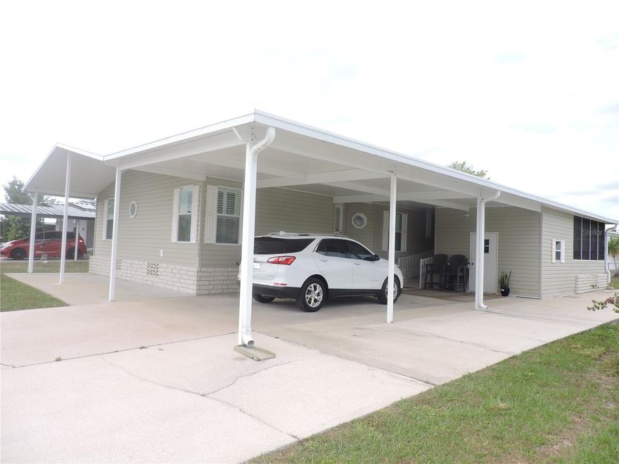 GREAT OPPORTUNITY TO BUY AN ABSOLUTELY IMMACULATE...MOVE IN READY 2 BEDROOM 2 BATH MANUFACTURED HOME. SITTING ON A NICE LOT IN CALOOSA LAKE VILLAGE, THIS SPACIOUS HOME HAS A SPLIT FLOOR PLAN AND A LARGE LIVING ROOM, DINING ROOM AND AN OFFICE, (OR POSSIBLE 3RD BEDROOM IF NEEDED). THE KITCHEN AND DINING AREA IS LIGHT AND BRIGHT WITH PLENTY OF COUNTER SPACE AND CABINETS, GOING OUT ONTO A GREAT FLORIDA ROOM. THERE IS ALSO A WORKSHOP/STORAGE AND COVERED CARPORT WITH EXTRA PARKING PAD. THIS HOME HAS IT ALL AND PRICED TO SELL. NO HOA FEES!!!!