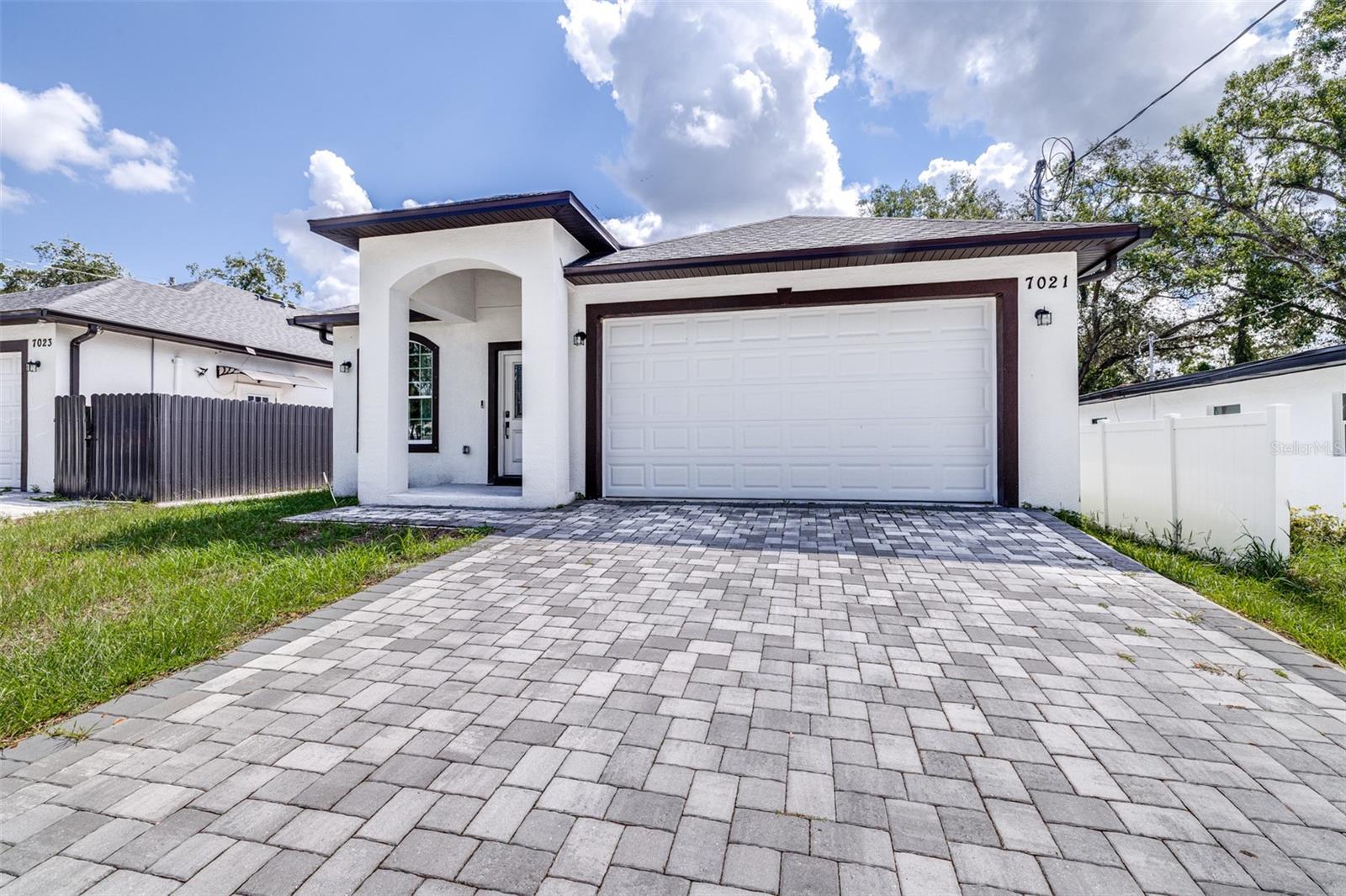 Located in one of Tampa’s most convenient and sought-after areas, this modern 2-year-old home offers the perfect blend of comfort, style, and functionality. Inside, you’ll find high ceilings and tile flooring throughout, giving the space a bright and open feel. The kitchen and dining area are thoughtfully designed with plenty of room for everyday living and entertaining. The bedrooms are spacious and comfortable, offering a peaceful retreat at the end of the day. Step outside to a fully fenced yard — ideal for pets, outdoor dining, or simply enjoying your own private space. This move-in-ready home is a great find for anyone looking to enjoy low-maintenance living in a prime location.