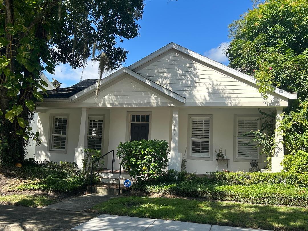 Extensively updated home with updated garage apartment in the convenient neighborhood of Hampton Park! Enjoy newer construction with the convenience of downtown living. Main home (3/2) has 1,314 square feet and features crown molding, plantation shutters, and beautiful manufactured wood flooring. Huge kitchen has 42” wood cabinetry, lots of drawers, granite countertops and designed farm house sink. Apartment above garage (1/1) has newer kitchen with granite, newer bath, manufactured wood flooring, walk-in closet and access to W&D in garage. Apartment rents for $1,500 and is leased until April 2026. Garage was previously split for a home office, and could be converted back to a functioning garage by removing a wall. Garage door and tracks are in place and operational. Home has a large screened back porch and has a mature mango tree! Roof installed 2020.