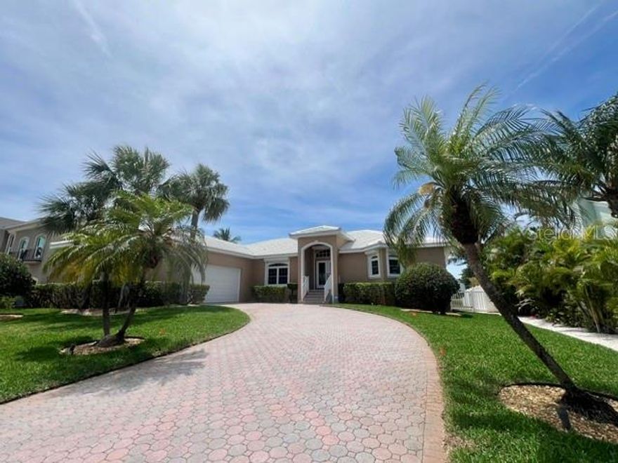 Welcome to Sands Point in Terra Verde, Florida. This custom waterfront residence was built in 1997 by Angelo Consolidated Inc. for the original owners and has been exceptionally maintained. The all-masonry construction and elevated 11’4” finished floor height provide added assurance, with no flooding history reported by the seller s. The home offers expansive water views and an open living, dining, and kitchen layout with sliding glass doors that lead to multiple Gulf-facing lanai. The interior includes three bedrooms and three full bathrooms, along with an open-concept main living area designed to capture natural light and water vistas. Numerous professional updates have been completed, and the property is offered fully furnished both inside and out. Exterior features include a private dock with a 10,000 lb boat lift and an air-conditioned garage equipped with an 8,000 lb car lift, accommodating up to three vehicles with extensive built-in cabinetry. Additional features include storm shutters, a private alarm system, and exterior security lighting. This home is conveniently located near Fort De Soto Park, Shell Key Preserve, area beaches, and downtown St. Petersburg, easy access to multiple international airports and cruise terminals.  Offering access to many of the region’s most desirable destinations.