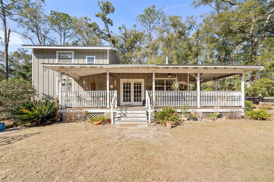 Own your own slice of Paradise...Tucked away at the end of a forested lane, this 3 bed 2 1/2 bath adorable home with a 5 acre parcel has approx 3 acres of fenced pasture and a pole barn ready for your horses to call home. A quick 2 mile drive will put you onto I-75 or into High Springs with its amenities. Some features include an updated great room open to the kitchen-dining area with a vaulted ceiling and a half bath, a master suite on the ground floor, and two bedrooms and a bath upstairs with an alcove at the top of the stairs suitable for a home office. Enjoy evening tea or reading on these spacious wrap-around porches offering views of the surrounding forest and pastures. Share s’mores with friends and family around the fire pit, under the stars. Very serene and peaceful. A must see !!