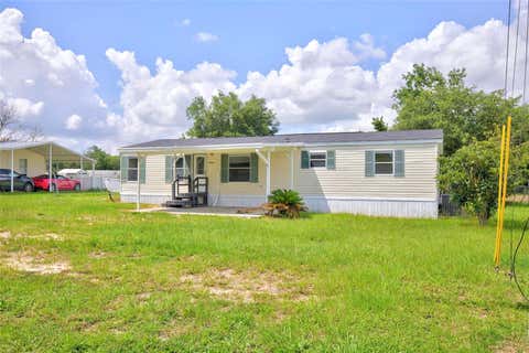 Photo of 6766 NE 1st Place, Ocala, FL 34470 (MLS # OM727287)