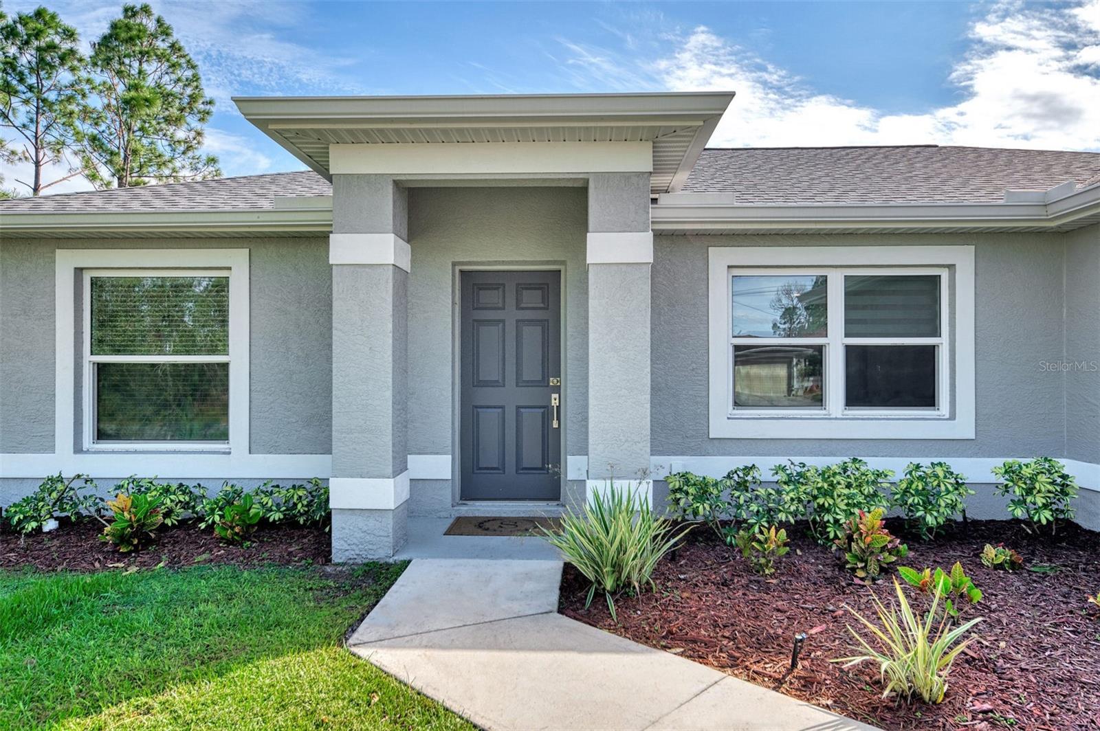 Welcome to 2775 Wyola in North Port Florida! This home is so beautiful and welcoming, one could imagine you are entering a model home. ASSUMABLE VA LOAN FOR ALL BUYERS. Sellers relocating! A few unique upgrades in this home include the ALL-AMERICAN PURIFICATION WATER SYSTEM, under-sink and refrigerator ice PUROMAX RO system, HURRICANE WINDOWS, a full ADT security system installed on all doors and windows, a LAWN IRRIGATION SYSTEM and a security light in the backyard. Some of the beautiful kitchen features are an extra-large island with a granite countertop, lots of beautiful, dark espresso shaker cabinets with soft close doors, stainless steel appliances, stainless steel sink, recessed canned lighting and more. The bathrooms are equipped with Kohler products which include porcelain sinks and tub and a large walk-in tile shower. The laundry room has a laundry tub and wall cabinets over the new Samsung WASHER AND DRYER for extra storage. There are CUSTOM BLINDS IN LIVING ROOM and KITCHEN and an ELECTRIC REMOTE BLIND on the sliders leading to the lanai. ALL FLOORS throughout the home are PORCELAIN TILE. North Port is the perfect place to call home with shopping, dining, GOLFING and entertainment. Just a short drive from here are the area's award-winning BEACHES and the SPRING TRAINING FACILITIES for the ATLANTA BRAVES and the TAMPA BAY RAYS! This home is a must HAVE. It's move in ready just for you today! Please contact Tony and Cheri Huffer for a personal showing.