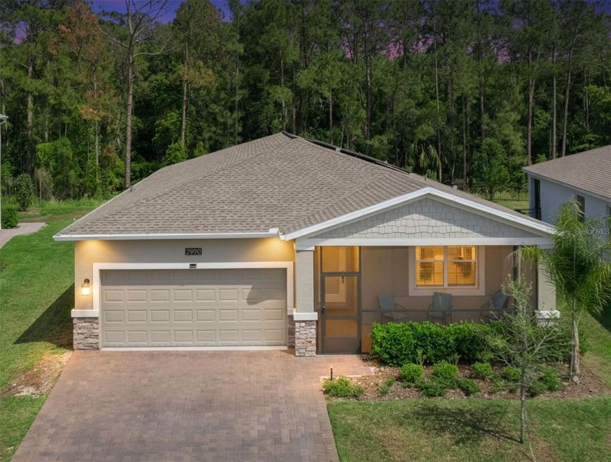 Welcome Home to the highly desirable Camden Park in the award-winning Providence Golf Community. Guard gate entry with relaxing drive to the back of the community. This beautifully upgraded Lennar Next Gen Freedom model, thoughtfully designed for both privacy and versatility. Conservation lot, with no rear neighbors. Enjoy peaceful water views from the oversized screened-in front porch, creating the perfect space to relax year-round. This home has a quieter setting with minimal traffic and added privacy. Upon entering you are greeted with brand new luxury vinyl flooring. Expansive kitchen with 42" wood cabinetry, stainless steel appliances, and additional storage space. A spacious breakfast bar and nook. The kitchen overlooks the living area, with a dedicated office/flex room. Primary suite features conservation views, ensuite bathroom with dual sinks, quartz counters, a linen closet and a large walk-in shower. Additional bedrooms and full bath are located on the opposite side of the home. Thoughtfully crafted as a true “home within a home,” the private attached suite features its own separate entrance, elegant living space, kitchenette, laundry closet, spacious bedroom, and full bath, creating the perfect retreat for multigenerational living, extended guests, or private accommodations. The extended driveway provides extra parking in addition to the two-car garage, which includes overhead storage racks. Upgrade new watersoftner 2025. Residents of Providence enjoy access to resort-style amenities including two pools with a waterslide, pickleball courts, a half basketball court, dog parks, an on-site restaurant, and championship golf. Minutes from major highways, local restaurants.