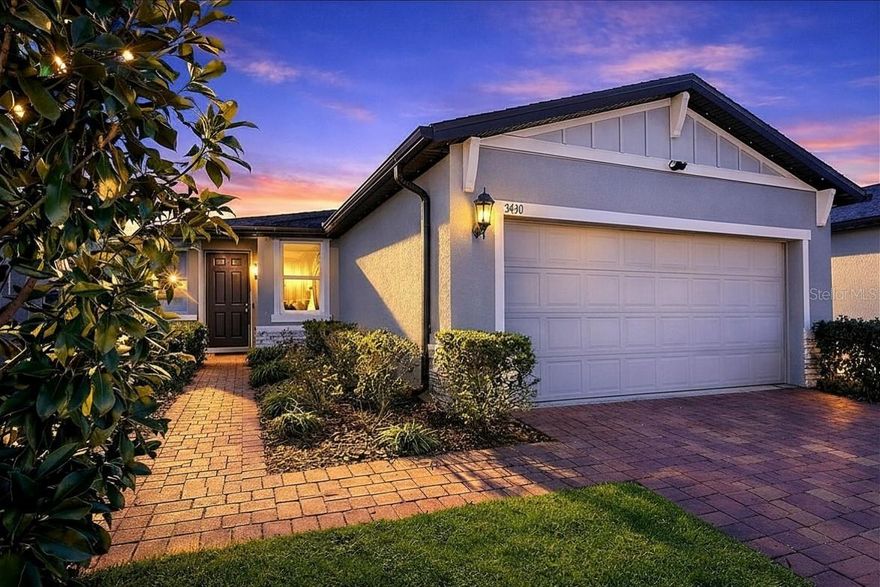 Welcome to a home that combines modern comfort with the relaxed charm of Central Florida living. This impeccably 3-bedroom, 2-bath residence is truly move-in ready and thoughtfully designed for both everyday living and memorable gatherings. The open-concept layout creates a natural flow between the main living spaces, offering the perfect setting for entertaining guests or enjoying quiet evenings at home.
A dedicated laundry room adds everyday convenience, while the two-car garage provides exceptional flexibility—including an air-conditioned bonus room currently used as a nail studio, ideal for a home office, creative space or gym. Every inch of the floor plan has been designed to maximize functionality without sacrificing comfort.  Step outside and discover your own private outdoor oasis. The fully fenced backyard features an expansive paver patio—perfect for weekend BBQs, entertaining friends, or simply unwinding and enjoying Florida’s beautiful year-round weather. Additional upgrades such as a water softener and whole-home filtration system add even more value and peace of mind.  Ideally situated in a sought-after Davenport location, this home places you just minutes from world-renowned attractions like Walt Disney World, along with premier shopping, dining, parks, and major highways—making commuting and entertainment effortless.  Homes offering this level of care, versatility, and location are rare. Schedule your private showing today and experience firsthand the lifestyle this exceptional property has to offer.