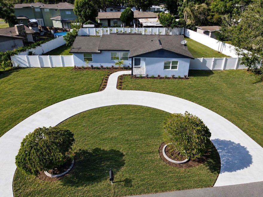 Welcome to this beautifully upgraded luxury pool home in the heart of Tampa featuring 4 bedrooms, 3 full bathrooms, and floor plan with TWO spacious master suites, perfect for multi-generational living or added privacy. This stunning home offers an open and airy layout with luxurious porcelain flooring throughout, a fully upgraded kitchen with custom cabinetry, granite countertops, and brand-new high-end stainless steel appliances, along with beautifully renovated bathrooms featuring modern finishes. Fresh interior and exterior paint give the home a crisp, move-in-ready feel, while the spacious floor plan is ideal for both everyday living and entertaining. Step outside to enjoy the huge sparkling pool, oversized fully fenced backyard, expansive front yard, and impressive circular driveway with ample parking and outstanding curb appeal. Situated on a very spacious lot, this property offers both luxury and functionality with major updates including a newer HVAC system (2025) and roof approximately 8 years old. This is a rare opportunity to own a beautifully updated Tampa home with premium upgrades, exceptional outdoor space, and a highly desirable layout all in one.