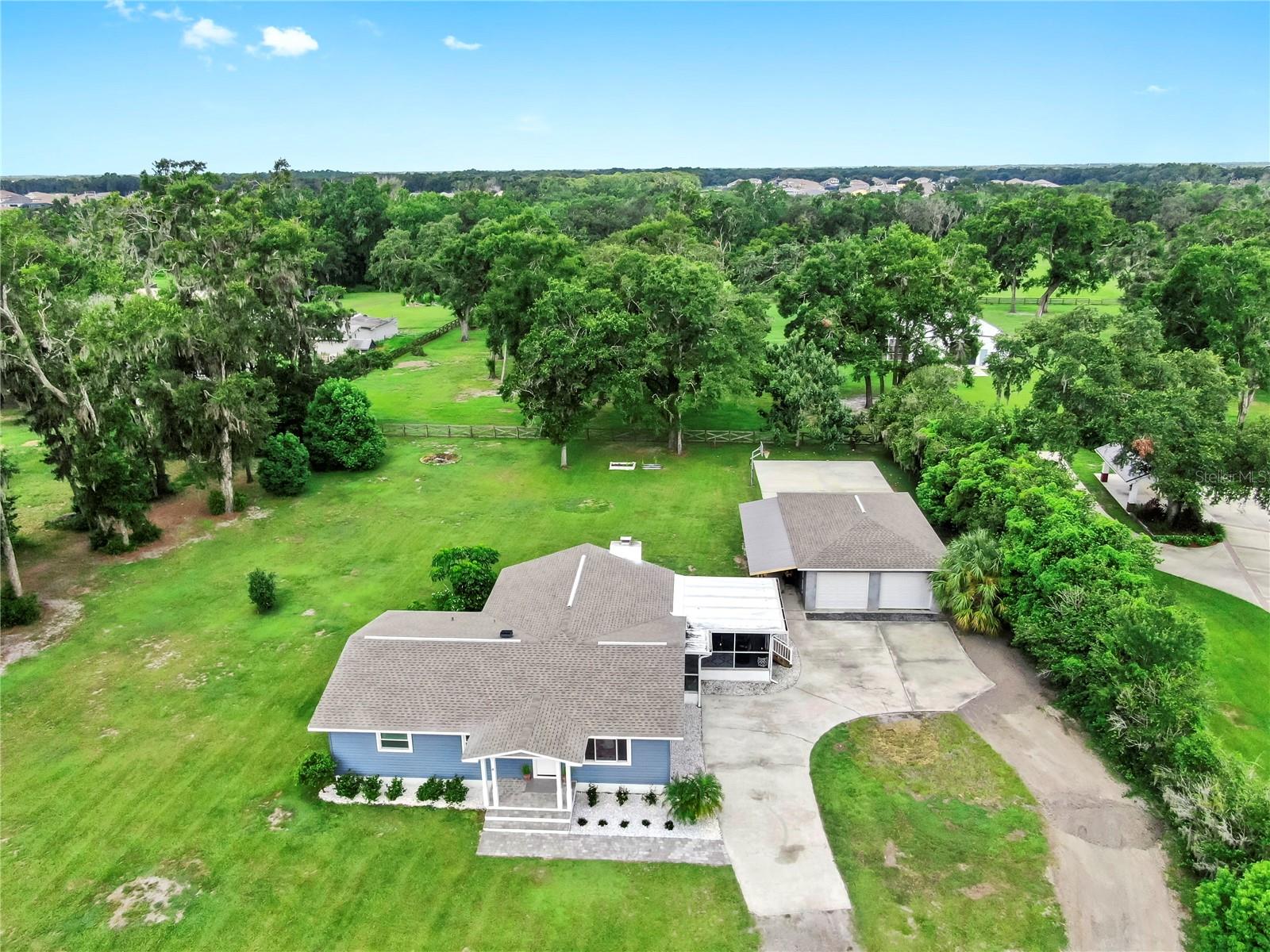 Stunning 4-Bedroom Retreat. Single Family Home on appx 1.5 Acres in Lithia, FL
-NO HOA/NO CDD!!!!!
Discover your dream home in the heart of Lithia, FL! This fully updated 4-bedroom, 2-bathroom gem sits on a sprawling appx 1.5-acre lot, offering privacy and space to thrive. Step inside to find spacious bedrooms bathed in natural light, complemented by modernized bathrooms and sleek new kitchen and bathroom flooring. The open, airy layout is perfect for both relaxation and entertaining.
Enjoy outdoor living at its finest with a screened porch with television for year-round comfort and a premium lighted sport court featuring a high-end basketball goal, ideal for family fun or friendly competitions. The expansive four-car garage provides ample storage and parking, while recent house upgrades include a 2020 roof, 2025 HVAC, 2020 water heater, 2023 windows and siding, new insulation, new duct work throughout, updated well, and a septic system which was cleaned in 2023 to ensure worry-free living.
This meticulously updated and maintained property, blends rural charm with contemporary convenience. The property has been proactively maintained with tree work done to minimize the risk of damage during hurricanes. New landscaping. Don’t miss your chance to own this move-in-ready haven. Schedule a tour today to experience its unique allure!
Owner is licensed real estate Broker. Furniture can be purchased separately. No flooding or hurricane damage to home in any of the hurricanes.