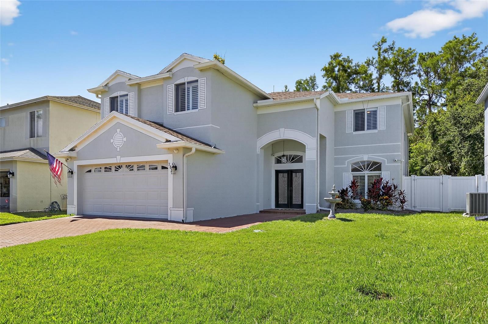 Welcome to 382 Rosalind Ln., an extraordinary home in the exclusive gated community of Bay Arbor in Oldsmar. This thoughtfully upgraded and impeccably maintained residence offers over 4,000 square feet of elegant living space, combining luxury, privacy, and smart-home functionality. Situated on a quiet cul-de-sac and backed by a peaceful conservation lot, the home features soaring ceilings, abundant natural light, Italian marble-look tile, a formal living and dining room, a spacious office, and a beautifully updated full bath. The open-concept main living area opens to a stunning screened-in patio with a heated spa, pool, waterfall, and wooded views — ideal for relaxation and entertaining. The chef’s kitchen boasts cherry cabinetry, granite countertops, stainless steel appliances, purified water, wine storage, a breakfast bar, and an eat-in nook. Upstairs you'll find four spacious bedrooms and a soundproofed 18' x 20' media room, easily converted into a second primary suite or flex space. The luxurious primary suite includes two walk-in closets, a spa-style bathroom with soaking tub and walk-in shower. The fully fenced backyard oasis includes a new outdoor luxury kitchen, pet turf, and smart-controlled pool and spa with a waterfall and fountain feature. Additional upgrades include new pool equipment, attic insulation, UV air purification, custom shutters, new water heater, full security system, vinyl fencing, lightning and surge protection, new AC unit upstairs, and more. Just 20 minutes from Tampa International Airport and close to top beaches, this rare gem delivers the ultimate in Florida luxury living.