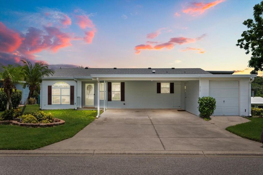 TRIPLE WIDE**NO STEPS**Walk-in Level with Sidewalk. SUBSTANTIAL PRICE IMPROVEMENT! 3/2 Split Plan on quiet cul-de-sac. 
Over 1900 sq feet of luxury with an enclosed Florida Room, inside laundry plus a spacious screened porch & Golf Cart Garage alongside Double Driveway with Covered Carport.
NEW ROOF 1/14/2025, NEW A/C 2022. Coffered/Tray Ceilings in Main Living Area. Crown Molding. Oversized modern kitchen with tons of storage and counter space. Bright, open floorplan is perfect for large family gatherings. Primary suite has 2 large closets, double vanity, dressing area and walk-in shower. 2 guest bedrooms and a tub/shower guest bath. In addition to the Air Conditioned Florida Room, there is a Screened back porch to enjoy as well. Great views on a quiet street. Price has been adjusted below market value for a Triple Wide(will most likely need carpet replacement). Located in Prestigious 55+ Zellwood Golf Community. Reduced Greens fees for Owners.