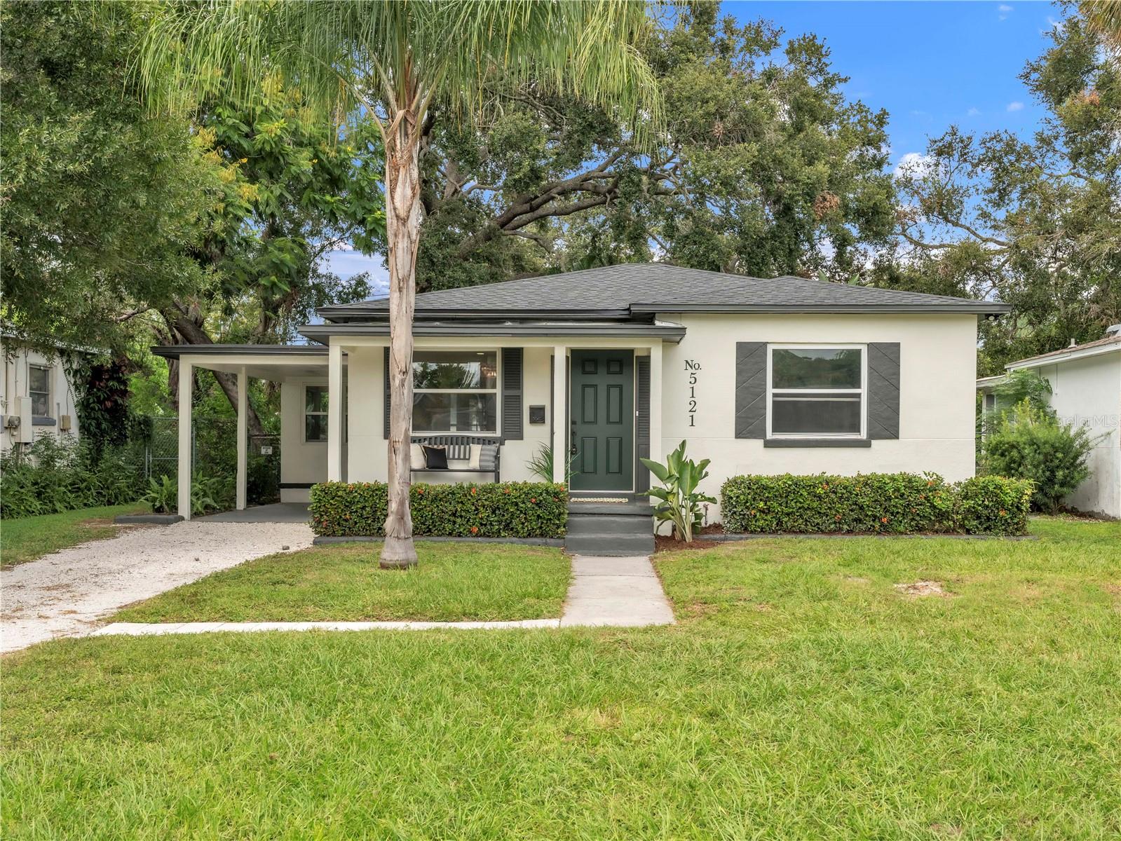 Welcome home to this beautifully renovated 2-bedroom, 1-bath block home, perfectly situated high and dry in the desirable Live Oak neighborhood of St. Petersburg. With a freshly painted exterior and lush greenery, this home radiates charm from the moment you arrive.
No detail has been overlooked in the updates: brand-new roof (2025), HVAC system (2025), and water heater (2025) bring peace of mind for years to come.
Inside, you’ll find an open concept living room that flows seamlessly into the upgraded kitchen, complete with quartz countertops, new cabinetry, and stainless steel appliances. Offering a versatile space with access to indoor laundry, the dining room is surrounded by windows, filling the space with natural light and offering a peaceful view while you gather around the table.
The generous primary bedroom provides comfort and retreat, while the stylishly updated bathroom features modern tilework and a tub-shower combo. A welcoming guest bedroom adds versatility for family or visitors.
Outside, the property shines with a large carport, extended driveway, and convenient alley access. The backyard is a true oasis—hardscape and shelled pathways lead to a paved gathering space, ideal for evenings around a bonfire or enjoying the Florida weather.
With its perfect blend of modern upgrades, thoughtful design, and inviting outdoor spaces, this home is move-in ready and waiting for its new owner. Schedule your showing today!
