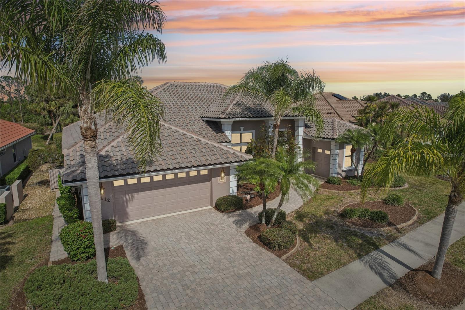 SIGNIFICANT PRICE ADJUSTMENT! A Rare Opportunity in Heron Creek Golf & Country Club. Welcome to a home filled with light, love, and limitless potential. Set along the serene 6th hole of the Marsh course, this residence has been the backdrop for cherished memories — and now, she’s ready for its next chapter. Step inside to discover soaring cathedral ceilings with skylights, an expansive great room bathed in natural light, and a layout designed for both lively gatherings and quiet moments. The heart of the home is the inviting kitchen with its L-shaped island, perfect for everything from morning coffee to evening cocktails. The generous primary suite is a true retreat, stretching the full length of the home, complete with a cozy sitting area, two walk-in closets, and a sunlit bathtub with a walk-in shower. Guests will enjoy their own private wing, including poolside access that makes every visit feel like a getaway. Outside, your screened lanai, private pool, and tranquil waterfall offer a front-row seat to Florida’s natural beauty — mature trees, manicured fairways, and peaceful greens. A brand-new roof, oversized garage, and dedicated golf cart garage provide comfort and convenience for years to come. Located in the vibrant, gated Heron Creek community, residents enjoy 27 holes of championship golf, tennis, a resort-style pool and spa, fitness center, clubhouse and an array of social events. With low HOA fees covering high-speed fiber-optic internet and full TV service provided by Hotwire Vision, lawn care, irrigation (and no CDD fees), you can focus on what truly matters: living the lifestyle you’ve dreamed of. This is more than a house — it’s a rare opportunity to create your own story in one of the most desirable neighborhoods on the in North Port. Don’t miss your chance. Schedule your private tour today — or explore the virtual tour from wherever you are.