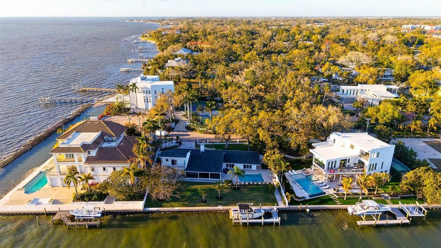 Introducing a perfectly positioned waterfront gem on Whitaker Bayou where the inlet opens up to Sarasota Bay. This charming 4BR/4BA is in the sought-after Indian Beach/Sapphire Shores community an exclusive location that captures both tranquility and convenience. The home is gated and, has been completely updated and offers stunning Bay and/or Bayou views from virtually every room. You will love the light and bright interior. A wall of windows spans through the living/dining area, opening up to the elegant pool and the large covered and screened patio area. 3 of the 4BR are ensuite, which is ideal for privacy. All of them in accordance with the theme of this property: Perfect & Seamless indoor /outdoor living! The master on the ground floor opens to the pool area, the 2nd suite opens to a large deck overlooking the Bayou and Bay and the 3rd suite (2nd floor) has a balcony that captures wonderful sunset views. Perfect for maritime enthusiasts, a beautiful extended dock, 120 foot of seawall, boatlift and immediate access to the bay. This waterfront property is also ideal for vacation rentals if your goal is to generate lucrative income. Upgrades include: new HVAC, newer roof and new water heater. A waterfront haven only steps away from cultural attractions, fine dining, and boutique shopping. Coastal living in one of Sarasota’s most desired downtown neighborhoods. Call for a private showing.