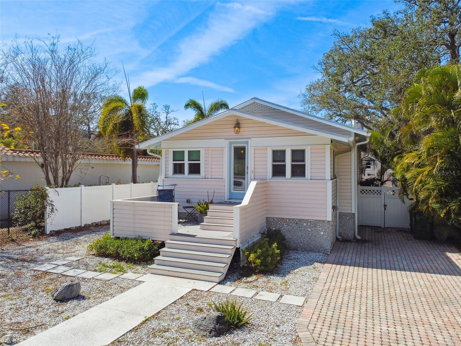 Welcome to this BEAUTIFULLY UPDATED 2/2 Bungalow with a separate 1/1 PRIVATE GUEST CASITA, located in the heart of historic Laurel Park in downtown Sarasota. Perfect for your private residence, seasonal home and/or income investment property. This inviting home features a welcoming front porch, perfect for relaxing, and is conveniently situated near the MURT trail for outdoor enthusiasts. The stunning kitchen boasts a modern open design and is equipped with premium finishes and fixtures, including a natural gas range for precise cooking. Reduce your carbon footprint and energy costs with the solar panel/voltaic system, on-demand gas hot water heater, updated electrical, plumbing and HVAC. Hurricane windows and doors provide peace of mind, while durable vinyl flooring flows seamlessly throughout the home. The primary bedroom boasts plenty of natural light, an en-suite bathroom and a spacious walk-in closet. Detached, air-conditioned guest casita, providing a private 1-bedroom, 1-bathroom, with private walkway and entry complete with kitchenette – ideal for guests, extended family, or even a potential rental opportunity. Enjoy outdoor living on the rear covered screened enclosure/lanai, patio, a privacy fenced yard with plenty of outdoor space, perfect for entertaining or simply enjoying the Florida sunshine. Just moments from Sarasota’s best dining, shopping, cultural attractions like Selby Gardens, the Sarasota Opera, the Art Museum, and the vibrant Saturday Farmers Market. Plus, the neighborhood features its own pocket park and playground on Laurel Street and even a kayak launch at the end of the block. MOVE-IN READY, a perfect blend of charm and modern comfort in a prime location! Schedule your private showing today!