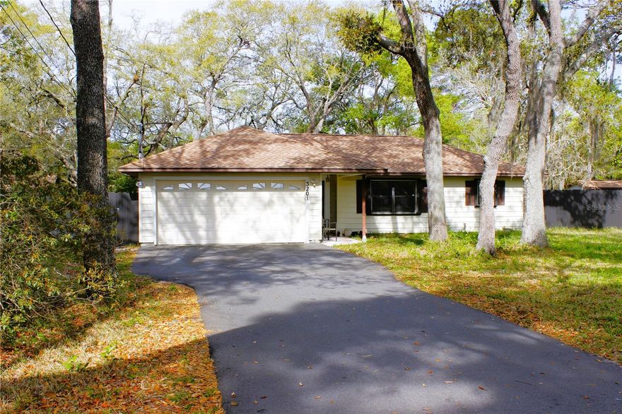 Discover this unique opportunity in Spring Hill! This property offers a great combination of comfort, space, and versatility. The main home features 2 bedrooms and 2 bathrooms. The garage has been converted into additional living space or 3rd bedroom with its own bathroom and private entrance.  The property also includes a separate guest structure, providing flexibility for multigenerational living or potential rental use. Situated on a spacious 0.80-acre lot, the home offers multiple access points for added convenience and privacy.  Enjoy Florida living year-round with a private screened-in pool, perfect for relaxing and entertaining. The fully fenced lot provides ample space and is surrounded by mature trees for a peaceful setting. Additional features include a large driveway with ample parking.  A versatile property with plenty of potential in a quiet Spring Hill location. Don’t miss this opportunity!