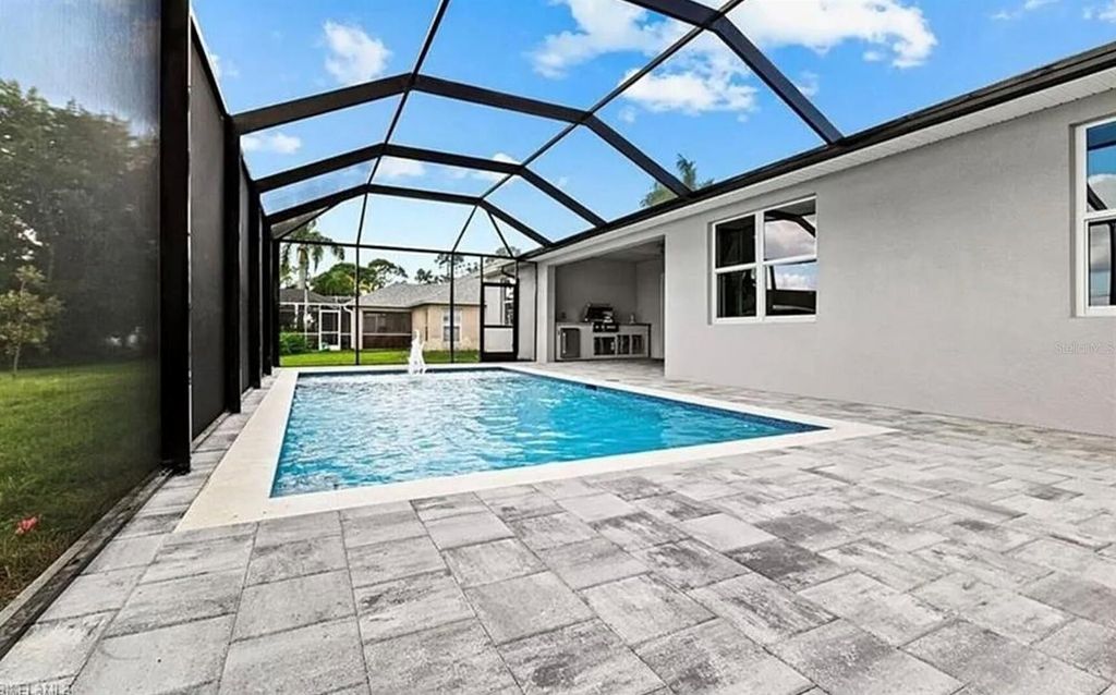 Photo of 2153 NW 18th Avenue, Cape Coral, FL 33993 (MLS # OM718770)