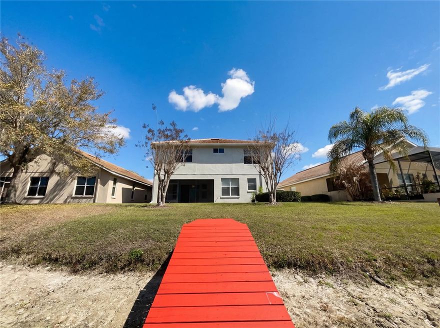 One or more photo(s) has been virtually staged. Welcome home to this stunning 3-bedroom, 3.5-bathroom home with a 2-car garage, ideally located in the highly sought-after Cory Lake Isles community. From the moment you arrive, you’ll appreciate the inviting curb appeal featuring a paver driveway and lush tropical landscaping. Step inside to discover soaring ceilings and a bright, open, airy feel complemented by a neutral color palette. Just off the entry, a spacious formal living area with a charming bay window creates the perfect space to welcome guests. A convenient half bathroom is also located on the first floor. The kitchen is well-appointed with granite countertops, stainless steel appliances, and ample cabinetry for storage. It opens to a generous family room, where large sliding glass doors lead to a screened-in back porch—an ideal spot to relax and unwind while enjoying peaceful pond views. The backyard also features a private dock, perfect for soaking in the tranquil waterfront setting. A spacious laundry room offers additional storage and a utility sink for added convenience. Upstairs, you’ll find all bedrooms, including a large secondary bedroom with its own ensuite bathroom. There is also a versatile loft or desk area in the hallway, ideal for a home office or study space. The primary suite is generously sized and features a large walk-in closet and a luxurious ensuite bathroom complete with dual vanities, a soaking tub, and a separate walk-in shower. Conveniently located near shopping, dining, entertainment, and medical facilities, this home truly has it all. Don’t miss your opportunity to make it yours—schedule your private showing today!