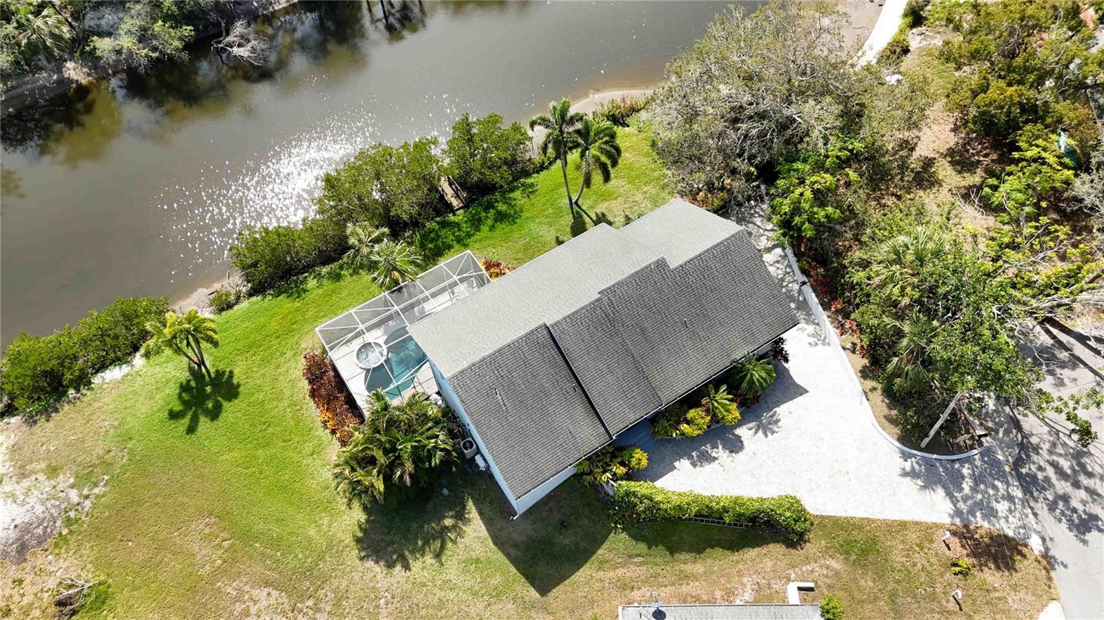 Priced below IMAPP tax evalutation of $1,280,800 Custom-built waterfront property that epitomizes modern living. This stunning 2,157 sq ft home offers 4 bedrooms and 3.5 bathrooms, along with a sleek, contemporary design characterized by clean lines and an open concept layout.
The house impresses right from the entrance, leading into a spacious living room with a wall of windows offering serene views of Phillippi Creek. The modern white kitchen is a chef's dream, featuring ample cabinetry, extensive counter space with a gas cooktop, and a large center island. Each bedroom, including a primary suite with dual closets and an en-suite bathroom, boasts natural bamboo flooring—complementing the large 30"x30" tile flooring throughout the common areas.
The massive lower level presents a flexible bonus space that opens to a pool lanai and spa, perfect for relaxation or entertainment. The property also includes a practical 20’ dock, ideal for boating enthusiasts with easy access to the intercoastal and bay despite two fixed bridges.
Additional highlights include an oversized extended garage that can accommodate two cars and recreational gear, and beautifully maintained grounds for gardening enthusiasts.
Situated in a prime Sarasota location, the property is just a short distance from essential amenities like Trader Joe’s, Sarasota Memorial Hospital, and Publix Super Market, and is close to Siesta Key's renowned beaches.
This home is being offered with the option Turn-Key furnished; perfect for anyone looking to embrace a stylish, convenient, and active Florida lifestyle.