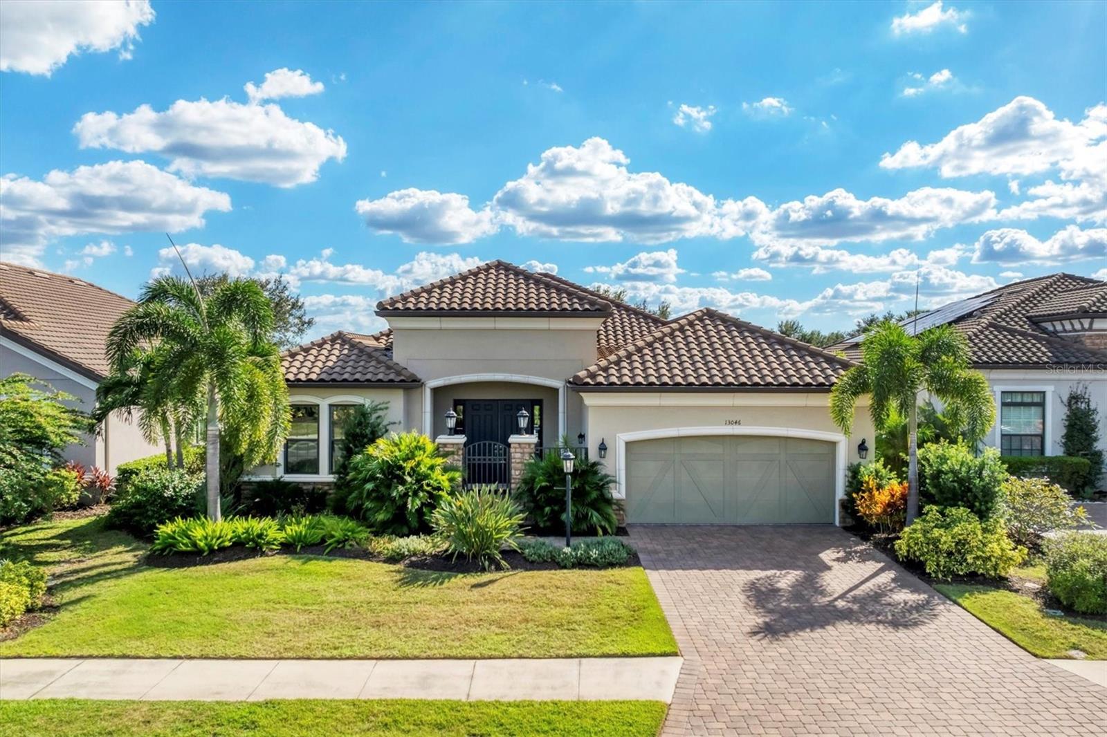 Experience the best of Florida living in this 3 bedroom, 2.5 bath home with 2 car garage that features an 8 ft extension, perfect for a Golf Cart or for extra storage. Located in the sought after Esplanade Golf and Country Club at Lakewood Ranch, this home includes a Full Golf Membership and access to world class amenities. Step through the inviting courtyard entry, an ideal spot to enjoy your morning coffee or unwind in the sunshine. Inside, the spacious Great Room flows seamlessly into a formal dining room and gourmet kitchen, which boasts Quartz countertops, stainless steel appliances, a breakfast bar, pantry, and cozy dinette. The Primary Suite features two walk in closets and a luxurious en-suite bathroom with dual vanities with Quartz tops, and a walk in shower. Enjoy Florida’s year round outdoor living with your private pool and panoramic screen enclosure, offering serene golf course views framed by mature landscaping for privacy and beauty. Living in Esplanade means enjoying a true resort lifestyle! Amenities include an 18-hole championship golf course, two clubhouses each with resort style pools and hot tubs, fire pits, fitness centers, Pickleball, tennis, bocce ball, a driving range, putting green, playground, dog park, full service spa and salon, and a culinary center. Dine and relax at the Bahama Bar & Grill at poolside, or at The Barrel House Bistro, and take advantage of the community’s vibrant social calendar organized by the on-site activities director. This maintenance free guard-gated community is ideally located near Lakewood Ranch Main Street, Waterside Place, UTC Mall, downtown Sarasota and Bradenton, St. Armand’s Crcle, and the world famous beaches of Lido Key, Siesta Key, Longboat Key, and Anna Maria Island. Discover elegance, comfort, and community, your dream home awaits in Esplanade Golf & Country Club at Lakewood Ranch!