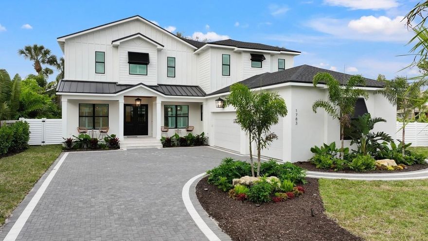 Welcome to an exquisite 3,613 sqft New Construction home nestled near a highly coveted and sought after location in Sarasota. Built by M&J Pham Development, this residence offers unparalleled combination of complete sophistication and designed for livable luxury. The warm and inviting palette is both trend-forward and timeless.  As you enter, you will be greeted by a soaring 2 story great room with stunning 24 ft high ceilings, featuring custom millwork and adorned with fixtures that cast a cozy glow throughout.  The Kitchen located off the great room is crafted to make every moment- and meal- something to remember. The contemporary and elegant kitchen is complete with top-of-the-line GE Cafe appliances, which include a 6 burner gas range, double wall ovens and wine fridge, accented in chic brushed gold, floor to ceiling cabinetry, a central island with stunning quartz waterfall edges with undermount lighting that anchor the space. Dual swinging doors open to a butler pantry featuring an additional sink and dishwasher.  The primary bedroom of this home is a true sanctuary is carefully presented for total relaxation. The e-suite bath features a soaking tub, dual vanity sinks, and an oversized walk in shower. The large format Calcutta Gold tile tied-in with the high-end fixtures define distinctive elegance. The spectacular wardrobe organized by California Closets add to the premium master suite. Rich softness and the enchanting gold palette have transformed a classic silhouette into something entirely new. As you ascend the grand staircase to the 2nd level living quarters, 3 bedrooms await you. Each considerate sizes, with finished walk-in closets and dedicated en-suites bathrooms. The 3rd suite features its own private lanai perfect for seeking solitude, for those moments when only the coziest place will suffice. The 2nd level is the perfect layout poised to create extra space for guests anytime. The large 10 ft glass sliding doors provide an unobstructed view of the heated saltwater pool and lanai. The patio is laid in shellstone interlocking pavers and exotic brazilian walnut wood in the ceilings. The custom summer kitchen by American Outdoor Cabinets and cabana bathroom provide the necessities for an idyllic setting for private and memorable outdoor gatherings. An exterior spiral staircase leads to another generous covered patio designed for savoring the breathtaking sunsets, sunrises, and refreshing breezes. Additional features include an expansive 3 car garage, Hurricane impact doors and windows, along with a large laundry room and separate dropzone off the garage, and bonus room perfect as an office or playroom complete all the accommodations needed for present day conveniences. This exceptional property is located a short distance from Southside Village and downtown Sarasota with convenient access to Siesta Key beach.