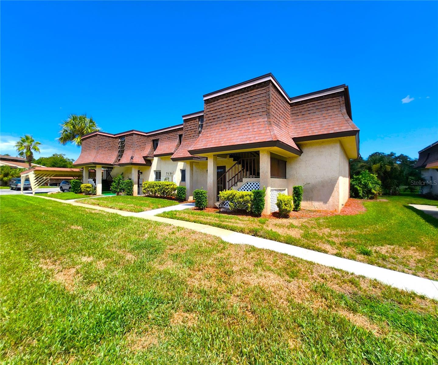 FIRST FLOOR condo located just 2 miles from downtown New Port Richey, new restaurants such as The Social, a short distance from Sims Park, James E. Grey Preserve, and approximately 11 miles from Anclote River Park.
Spacious and comfortable floorplan measuring approximately 1,044sf and loaded with several beneficial features including:
•A spacious living room and dining room combo, attractive faux wood vinyl flooring, ceramic tile in all wet areas including the Florida Room.
•The kitchen is equipped with all appliances: refrigerator, electric stove, dishwasher, hood vent, includes a spacious closet pantry, solid surface countertops and space for a small table.
•The master bedroom is at least 15’x15’, features a set of glass sliding doors leading to the Florida Room, a large walk-in closet, and a private master bathroom.
•The master bathroom comes with a walk-in Whirlpool bathtub with Jets & a built-in Seat, stone countertops, and a medicine cabinet.
•The guest bedroom is not your typical size. This room is at least 12x15 and includes a built-in closet and ceiling fan.
•The guest bathroom located two-three steps from the guest bedroom is equipped with a shower and bathtub, stone countertop, medicine cabinet, and houses the laundry closet.
•The spacious INTERIOR LAUNDRY closet includes shelves and a side-by-side washer and dryer set.
•Your fully enclosed, covered and oversized Florida Room is approximately 7’ x 34 feet deep, it includes Jalousie Windows with screens, TWO large storage closets, and no rear neighbors but a relaxing greenbelt view.
•HVAC 2018, HVAC Condenser in 2019, Water Heater in 2017.
•The sellers are repairing the canned lighting in the kitchen and other small cosmetic condo repairs.
- About the Community:
•Monthly association dues of just $345 include NEW ROOF installed in 2024, assigned covered Carport #42 with Electrical Outlet for EV or Golf Cart, secured community mailbox station, escrow reserves, master insurance, exterior maintenance, grounds maintenance, rubbish removal.
•There are no outstanding association assessments for 2025 – governing documents & financials readily available for public view and attached to the listing.
•Although Magnolia Valley is an age restricted community intended for occupancy by people fifty-five (55) years of age and older, occupants who are at least eighteen (18) years of age are also allowed if the main occupant/owner is 55 years or older.
•Those under the age of 18 may visit and stay for a maximum of 30 days per year.
•New owners may lease to family and close friends only for a minimum of 4 months straight after closing, no waiting period required.
•Buyer and tenant approval required by the association.