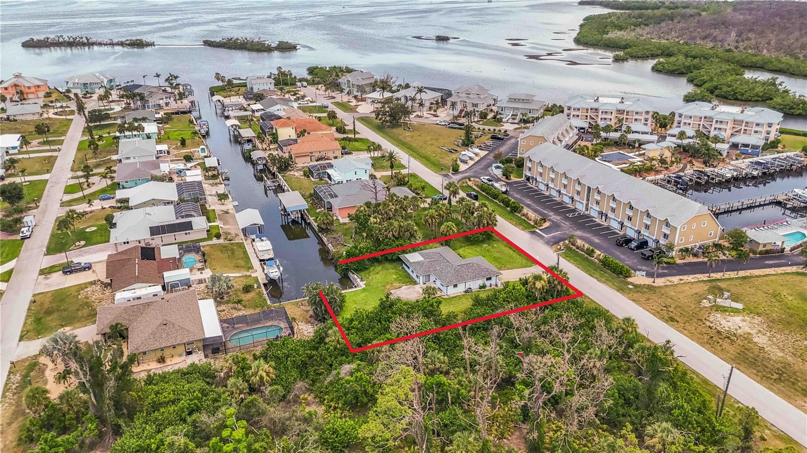 Sailboat accessible waterfront home only 5 Minutes to the Gulf of Mexico by boat. Walk, bike or drive only 3 Miles to Englewood Beach, 4 Miles to Palm Island Ferry, or 2 Miles to the Community Park which features 315 acres consisting of trails, dog parks, 2 community pools, fitness center and much more. This home is priced to sell and loaded with potential—whether you're seeking a full-time residence, seasonal retreat, or investment property. Situated on an expansive 17,500 sq ft lot (nearly ½ acre), this property offers direct access to the Intracoastal Waterway in just 3 minutes with no bridges to the Gulf of Mexico—a dream come true for boating enthusiasts! The L-shaped lot wraps around the end of the canal, providing 60 feet of seawall, a dock, davits, and ample space to add a boat lift or even a large pool. Watch dolphins and manatees right from your backyard and enjoy fishing or sunset cruises to nearby sandbars and waterfront restaurants.
The home itself features 2 bedrooms, 2 bathrooms, a spacious family room, a 2-car garage, and a canal-view lanai. A 20x30 concrete patio offers the perfect spot for grilling or future expansion—enclose it for additional living space or a third bedroom. Inside, the home is clean and ready for your design ideas. Several major updates have already been completed, including a new roof in 2023, AC in 2021, electrical panel in 2019, and water heater in 2019. Located close to shopping, dining, and entertainment, this property sits in the heart of all that Englewood has to offer—without the burden of an HOA, CDD, or deed restrictions. Englewood is a charming Gulf Coast town known for its uncrowded, natural beaches and strong growth in waterfront property values. This home has a strong rental history and is a proven income-producer with both annual and short-term tenants. Plus, the adjacent lots on either side are currently for sale by separate owners, offering a rare chance to expand your footprint or create your own private estate. Don’t miss this incredible opportunity to own a piece of waterfront paradise in this thriving coastal community. Check out the property website for floorplan and videos and virtual walkthrough. https://tours.snaphouss.com/1965oregontrailenglewoodfl34224?b=0