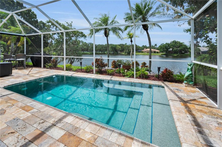 One or more photo(s) has been virtually staged. Welcome home to Kingsmill at East Lake Woodlands, a highly sought-after community in Oldsmar, Florida. Enter this exquisite, gated community that beautifully blends refined living with a sense of serene retreat. Nestled among lush nature preserves and world-class golf courses, this community offers residents an unparalleled lifestyle of privacy, elegance and leisure. With its prime location near Tampa Bay, residents enjoy both tranquility and convenient access to fine dining, shopping and cultural vibrancy. It is a community defined by sophistication, scenic nature and timeless appeal.  This beautifully reimagined 3-bedroom, 2-bathroom residence exudes artistry and refinement, beginning with a spacious primary suite which offers a walk-in closet and fully renovated bathroom. An executive room transitions seamlessly between an office, den, or retreat. The gourmet kitchen features soft-close shaker cabinetry, a dedicated butler's pantry, stone countertops and sleek, new gunmetal stainless-steel appliances, creating the perfect environment for relaxation and entertainment. Expansive living spaces open to a sparkling pool that overlooks a serene lake, delivering the perfect balance of elegance and tranquility. With a brand-new roof and HVAC system (August 2025) and every finish meticulously maintained, the home presents itself as pristine and polished.  It is an exceptional opportunity to embrace elevated living within this highly sought-after community. It is truly a must see! Various photos have been virtually staged - see photo description for identification of virtually staged photos.