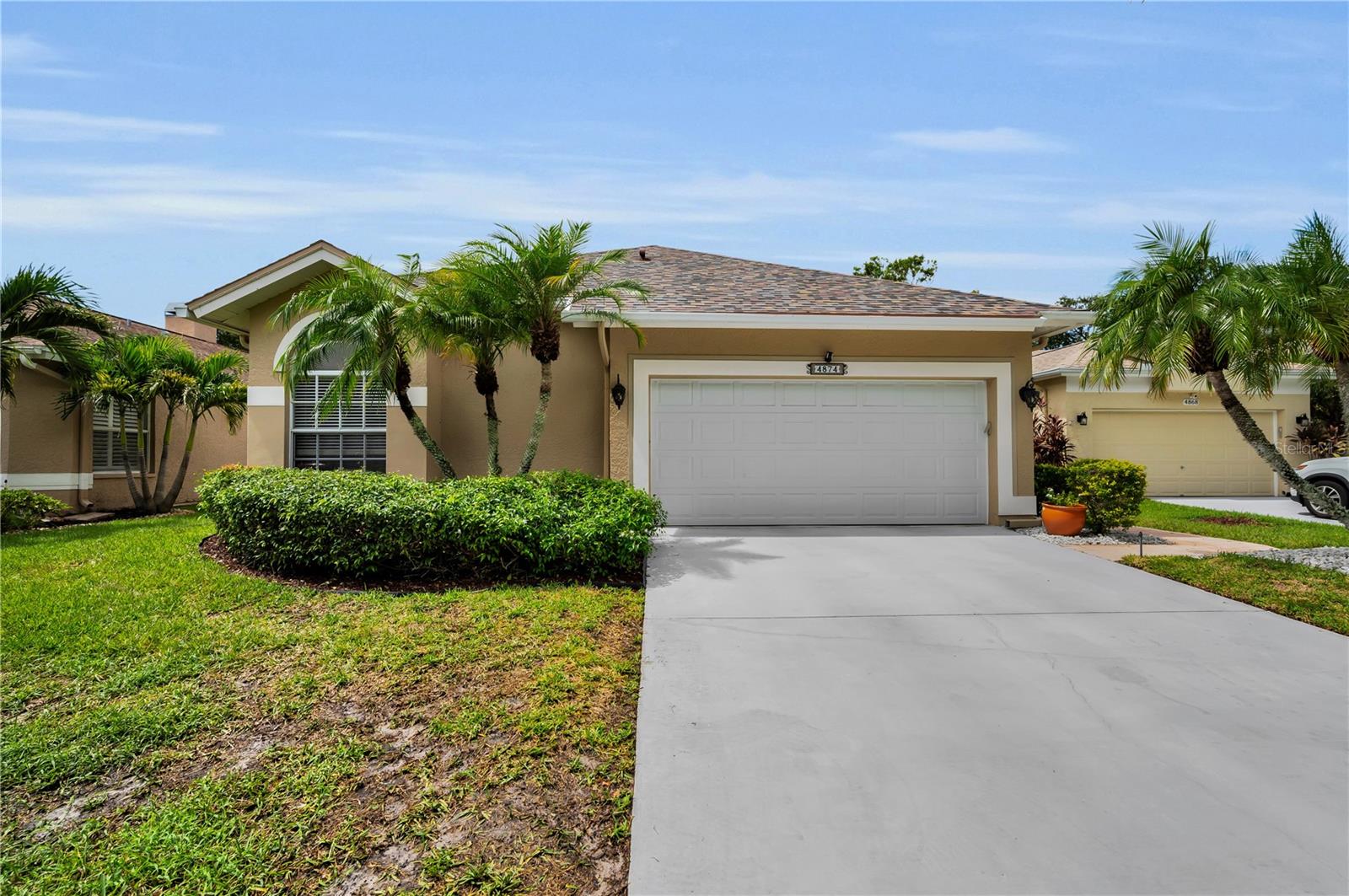 Welcome home to Kingsmill at East Lake Woodlands, a highly sought-after community in Oldsmar, Florida. Enter this exquisite, gated community that beautifully blends refined living with a sense of serene retreat. Nestled among lush nature preserves and world-class golf courses, this community offers residents an unparalleled lifestyle of privacy, elegance and leisure. With its prime location near Tampa Bay, residents enjoy both tranquility and convenient access to fine dining, shopping and cultural vibrancy. It is a community defined by sophistication, scenic nature and timeless appeal. This beautifully reimagined 3-bedroom, 2-bathroom residence exudes artistry and refinement, beginning with a spacious primary suite which offers a walk-in closet and fully renovated bathroom. An executive room transitions seamlessly between an office, den, or retreat. The gourmet kitchen features soft-close shaker cabinetry, a dedicated wine room, stone countertops and sleek, new gunmetal stainless-steel appliances, creating the perfect environment for relaxation and entertainment. Expansive living spaces open to a sparkling pool that overlooks a serene lake, delivering the perfect balance of elegance and tranquility. With a brand-new roof and HVAC system (August 2025) and every finish meticulously maintained, the home presents itself as pristine and polished. It is an exceptional opportunity to embrace elevated living within this highly sought-after community. It is truly a must see!