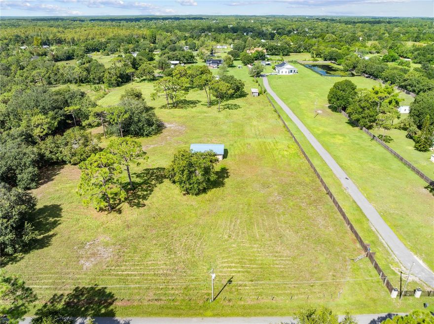 Beautiful 2.38-acre builder-ready lot with all major improvements already completed. Property includes a 24x36 framed shop, fully installed and septic system, and 200 amp underground electrical service. Small horse stables are located at the rear of the property. The land is cleared with large mature trees offering privacy and shade. Ideal for building your dream home with room for animals, hobbies, or additional structures. Don’t miss this ready-to-go opportunity in a peaceful, natural setting.