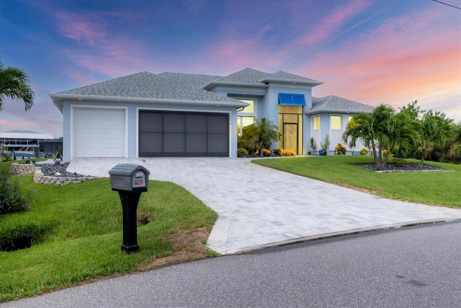 Prime location, luxury, and lifestyle come together beautifully in this gorgeous 3-bedroom, 2-bath coastal retreat in the highly sought-after waterfront community of South Gulf Cove. Situated on an oversized half-tip lot with 145 feet of rip-rapped waterfront and southwest exposure, you’ll enjoy breathtaking sunsets and serene water views every evening.
A boater’s paradise, this property offers quick access to open water with only one bridge and a 2-minute ride to fast water. The 10,000 lb. boat lift with canopy, water, and electric sits alongside a maintenance-free 8' x 30' composite dock, making your waterfront adventures seamless and stress-free.
This home is loaded with high-end upgrades and thoughtful design throughout. The screened front porch welcomes in the Florida breeze, while impact-resistant windows and doors provide peace of mind and storm protection. As you enter through the double front doors, you’re greeted by an airy, open-concept living area filled with natural light, zero-corner sliders, and dramatic 14-foot tray ceilings in the living room. A custom stone entertainment wall with built-in decor cubbies and an electric fireplace adds a cozy and upscale touch.
The chef’s kitchen is both functional and beautiful, offering soft-close cabinetry, extra pull-outs, Level 4 granite countertops, an oversized island, and a striking stone-and-marble backsplash. Top-of-the-line Samsung Black Stainless appliances include a double-door convection oven and French door refrigerator. The laundry room is equipped with a Samsung washer and dryer and features a built-in pantry for additional storage.
A split-bedroom floor plan ensures privacy, with the main suite tucked away on one side of the home. The spacious primary bedroom features dual walk-in closets and a luxurious bathroom with two separate vanities, a private water closet, and a walk-through tiled shower complete with a rain shower head and handheld wand for both convenience and relaxation. The guest wing includes two well-appointed bedrooms—one with sliding door access to the lanai—and a beautifully tiled bathroom with walk-in shower and pool access.
Step outside to a backyard oasis where upgraded St. Augustine grass enhances the lush landscaping and curb appeal. The expansive lanai is perfect for entertaining or unwinding, featuring a built-in bar area with a bar fridge and wet sink, and an electric fireplace that adds ambiance and warmth on a cool Florida evening. An electric roll-down hurricane screen transforms the space into a comfortable indoor-outdoor retreat, protected from the elements yet open to the view.
Enjoy the inviting pool with a large sundeck and wide steps, framed by four picture-window screens for unobstructed waterfront views. For even more relaxation, soak in the above-ground Vita Spa hot tub with 52 jets and let the stress of the day melt away.
Additional features include a spacious 3-car garage with built-in overhead shelving and a utility sink, sliding screens on the double garage door, full irrigation system with a new pump, blown insulation throughout the entire roof area, a 30-amp generator outlet, and a paver walkway from the garage to the dock for safety and convenience. Located just minutes from Boca Grande beaches, top-rated golf courses, world-class fishing, and boating access to waterfront dining, this South Gulf Cove gem offers the ultimate Florida lifestyle.
Don’t miss your opportunity to own this exceptional waterfront home!