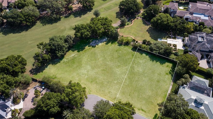 Positioned along the back nine of Isleworth’s renowned championship golf course, this 0.53-acre home site offers beautiful golf living. Nestled in a cul-de-sac near the 12th fairway, the lot presents the perfect opportunity to build within the gates of Central Florida’s most iconic golf course community.