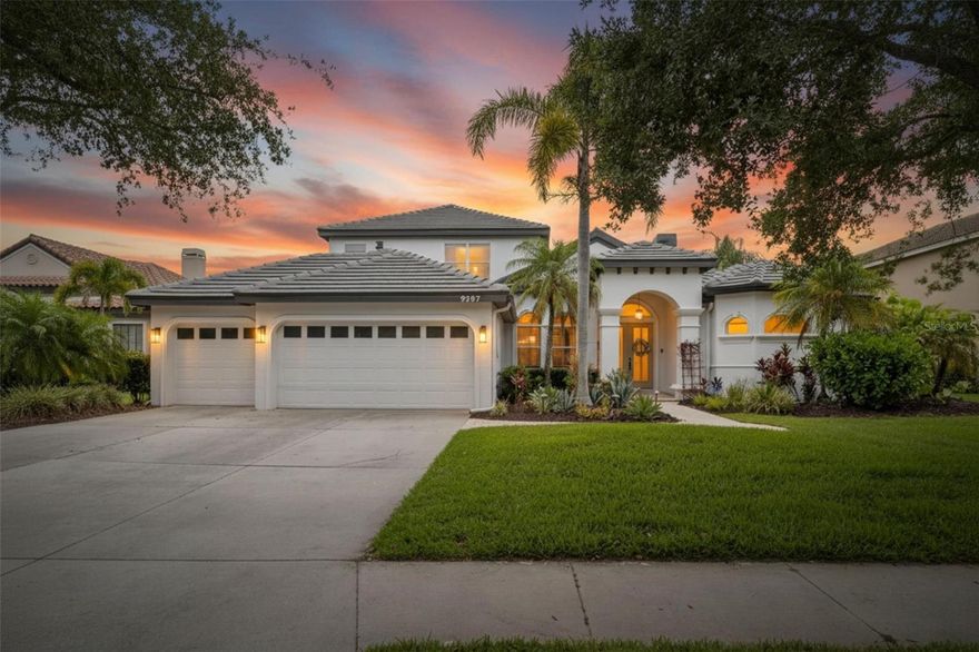 Welcome to luxury living in the highly sought-after Sanctuary area of River Club! Situated on a premium homesite with breathtaking water and preserve views, this extensively renovated custom residence offers over 3,700 square feet of elegant living space with NO CDD fees and low HOA dues. This stunning 4-bedroom, 3.5-bath home showcases a dramatic open-concept floor plan with designer upgrades throughout, including luxury laminate flooring, modern fixtures, extensive crown molding, wide baseboards, fresh interior and exterior paint, and a beautifully remodeled chef’s kitchen featuring quartz waterfall countertops, wood cabinetry, stainless steel appliances, breakfast bar seating, walk-in pantry, and casual dining area overlooking the pool. The outdoor living area also includes a completely renovated pool bathroom with the same luxury flooring and quartz countertop vanity. The spacious first-floor primary suite offers French door access to the lanai, a spa-inspired bath, and custom walk-in closets. Additional features include a private office/den, formal dining room, gas fireplace, second-floor bonus/media room with balcony, and oversized secondary bedrooms. Major recent improvements include a NEW tile roof installed in 2025 and an upgraded electrical system with rewired panel and generator plug capability, allowing a portable generator to power the entire home except the main floor AC system. Enjoy true Florida resort-style living outdoors with a panoramic screened lanai, PebbleTec saltwater heated pool and spa, outdoor kitchen and bar, dedicated pool bath, lush landscaping, and incredible lake and wildlife views. Additional upgrades include newer HVAC systems with ultraviolet filtration, re-screened lanai, and upgraded entry doors. River Club offers a deed-restricted golf community lifestyle with no mandatory golf membership, excellent schools, and convenient access to Lakewood Ranch shopping, dining, golf, hospitals, and entertainment.