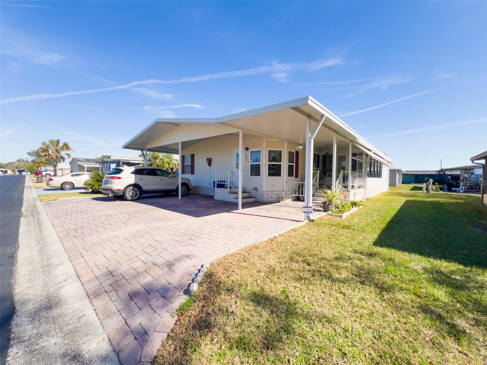 Welcome to this well-maintained 3-bedroom, 2-bath manufactured home in friendly Timberlake Estates. Bright, open living spaces and a large Florida room make this home perfect for entertaining or enjoying quiet mornings. The L-shaped kitchen flows into a formal dining area and a generously sized living room, creating a comfortable, functional layout for everyday living.
Thoughtful split-bedroom floor plan places the private primary suite on one side with a large en-suite bathroom and walk-in shower, while two additional bedrooms on the opposite side are ideal for guests, family, or a home office. Additional highlights include two storage rooms and ample closet space, plus the peace of mind of a cleared 4-point inspection.
Community and conveniences:
Low monthly HOA (includes water)
Residents-only clubhouse and swimming pool
Shuffleboard courts and a dock for peaceful waterfront moments
No lot rent
Easy access to Tampa — close to shopping, dining, and local attractions
This move-in ready home in a welcoming, well-kept community won’t last long. Schedule your showing today and experience Timberlake Estates living for yourself!