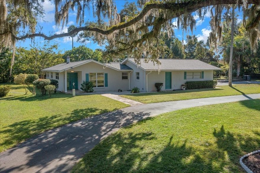Welcome to your own private slice of Old Florida charm! A truly unique design, this home centers around a crystal-clear inground pool. The exceptional courtyard style layout offers seamless indoor-outdoor living.  The spacious living area boasts warmth and architectural charm with a vaulted tongue-and-groove wood ceiling anchored by a stunning stone fireplace. The dining room is just off of the living area and the spacious kitchen featuring white cabinetry, stainless steel appliances with eat in area! Endless possibilities with two bonus rooms in addition to the 3 bedrooms! In the market for a short term rental? Turnkey potential with unforgettable charm! Guests will love the private courtyard-style pool, multiple access points from inside the home, and the peaceful, tree-shaded setting. Thoughtful design, modern comforts, and a location that feels like a hidden gem make this one a high-performing investment waiting to happen. Recent updates include a new roof and asphalt driveway in 2021 and a new 200 amp electrical panel in 2025. All five sets of sliding glass doors were updated to low-e energy efficient double paned glass in 2025. No HOA!  Nestled on a generously sized 0.78 acre lot with a circle driveway convenient to downtown Ocala, the Hwy 200 corridor and I-75. Schedule an appointment for a private tour to truly appreciate all this property has to offer!