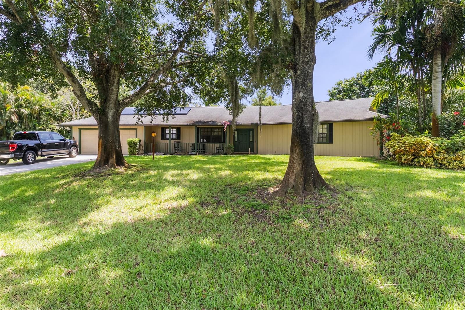Beautiful Vero Beach custom-built 3 bedroom 3 bath country ranch with POOL and SPA! Featuring low electric bills every month with installed SOLAR power. Imagine arriving at your new sanctuary, situated on a coveted corner lot spanning over half an acre, offering both privacy and a grand sense of arrival. A charming front porch beckons, inviting you to relax in a rocking chair and savor the gentle Florida breezes. Step inside to discover a home thoughtfully designed for both gracious entertaining and comfortable everyday living. Just past the newly-tiled foyer, the heart of the home unfolds into an expansive, pentagon-shaped living room, a striking architectural feature, complete with new carpet, a cozy fireplace and two sets of French doors that seamlessly open to your private outdoor oasis. Beyond the living room, a full dining room and generous eat-in kitchen await, ready to inspire culinary adventures and serve as gathering points for family and friends. This home offers three spacious bedrooms and three full bathrooms, providing ample comfort and privacy for everyone. The main bedroom is a retreat, boasting a large walk-in closet and a separate dressing and makeup area, offering a dedicated space for personal pampering. Practicality meets luxury with a huge laundry room. Outside, your private screened enclosure encompasses a sparkling swimming pool, complete with a hot tub / spa, promising endless days of relaxation and enjoyment under the Florida sun. Even better, no HOA! Water heater updated in 2020. This is more than a house; it’s an opportunity to embrace the quintessential Vero Beach Florida lifestyle, offering space, comfort, and the allure of coastal living on an impressive scale. To truly appreciate the unique character and expansive potential of this Vero Beach gem, a private showing is essential. Please contact me to arrange your exclusive tour today!
