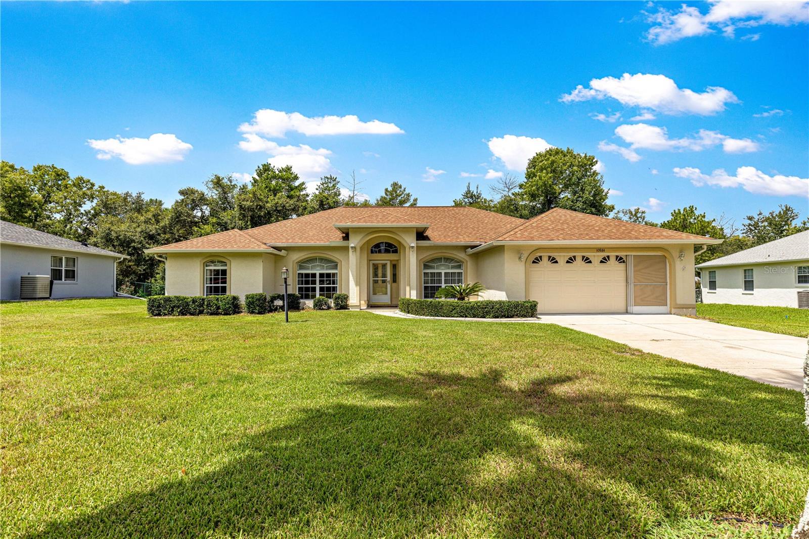 Beautiful 3-bedroom home with office/den in 55+ community – Privacy, Space & Style! Welcome to this spacious and well-maintained 3-bedroom, 2-bathroom home with an additional office/den, located on a generous .45-acre lot in the desirable 55+ section of Marco Polo Village within Kingsland Country Estates / Whispering Pines. Enjoy peace, privacy, and natural beauty with a partially fenced backyard that backs up to serene woods and mature trees. With over 2,800 square feet under roof, this home offers comfortable living with cathedral ceilings, tile and laminate flooring throughout, and charming plant shelves that add architectural interest. The living room is bright and welcoming, flowing seamlessly into the spacious kitchen featuring a breakfast bar, ample cabinetry, and all appliances included. A dedicated dining area makes entertaining easy. The master suite has a walk-in closet, large vanity with make-up counter, and a glass-enclosed walk-in tiled shower. Two additional guest bedrooms are well-sized and share a guest bath with its own walk-in glass shower. An inside laundry room, complete with utility sink and built-in cabinetry for extra storage. Step outside to the screen-enclosed porch with ceiling fans and a storage closet, or enjoy the open patio perfect for grilling or relaxing while taking in the wooded view. Additional features include a 2-car garage with an extra screen garage door, newer roof (2020), and super low HOA fees. Don’t miss this opportunity to live in a peaceful, established community with modern comforts and natural surroundings.