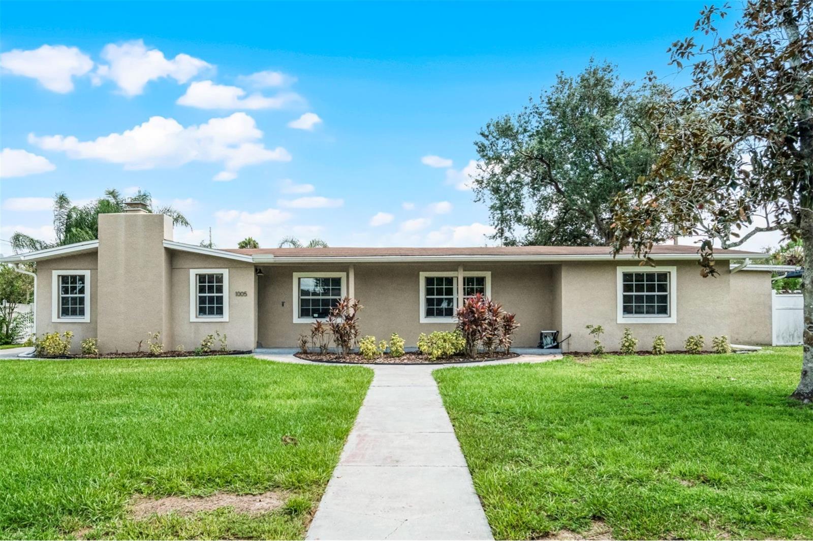 One or more photo(s) has been virtually staged. Welcome to 1005 Marabon Ave, a beautifully maintained 3-bedroom, 2-bathroom POOL home that blends comfort, style, and convenience. Located just minutes from SR408, this property offers easy access to downtown Orlando, shopping, and dining. Inside, you’ll find durable TILE flooring throughout, creating a sleek and low-maintenance living space. The oversized living room features a cozy wood-burning fireplace, perfect for relaxing evenings. The expansive kitchen overlooks the backyard and features granite countertops, a spacious island, and stainless-steel appliances—ideal for both everyday living and entertaining. The primary suite includes a large walk-in closet, a tiled ensuite bathroom, and a versatile bonus room, adding flexibility and comfort. Two additional bedrooms each offer dual closets, providing ample storage. Step outside to a spacious, fenced-in backyard complete with a large covered patio and a screen-enclosed pool with surrounding deck—your own private oasis for gatherings or quiet afternoons. The centrally located indoor laundry room features built-in cabinets and a newer washer and dryer (2019). Recent upgrades include a brand new Rheem HVAC system (2025), a remodeled second bathroom (2025), a new dishwasher (2024), and newer rain gutters (2020). This home is move-in ready and waiting to welcome its next owner.