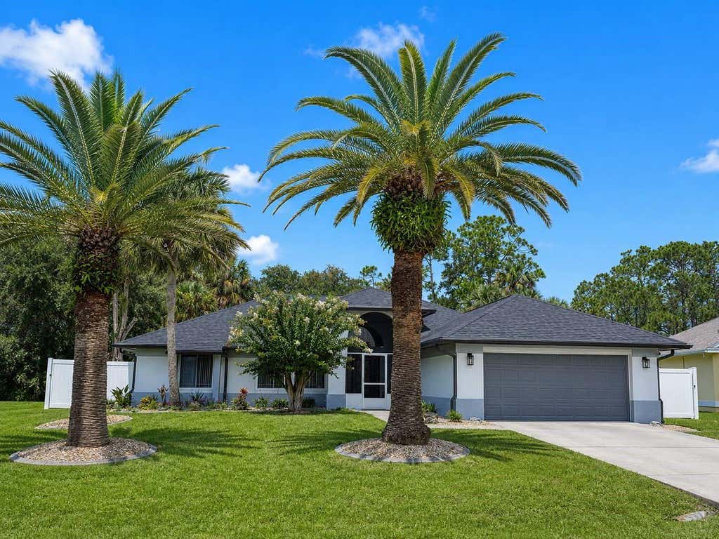 Photo of 77 Cimmaron Drive, Palm Coast, FL 32137 (MLS # FC320316)