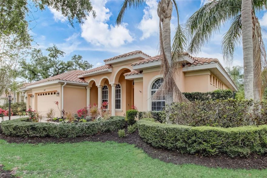 Life at the Venice Golf and Country Club is a sought-after experience, and this beautifully secluded residence is the perfect complement. Ideally situated on a quiet cul-de-sac, resting on more than a quarter-acre of lush, manicured property that overlooks calming lake waters. You will love the convenience of moving right into this updated three-bedroom home. Brimming with Florida charm, significant recent renovations include new luxury vinyl flooring, coffered and tray ceiling treatments, newer HVAC system with expanded ductwork, plantation shutters, LED lighting, crown molding, and updated electrical. From the double-door foyer entry, the sunlit interior opens to a thoughtful design of the spacious living and dining room. The bright and open layout spans nearly 2,700 square feet, is organized around the kitchen steps away, and creates a wonderful environment to entertain with ease. This gourmet chef’s space overlooks the family room and features solid wood cabinetry with under cabinet lighting, stainless-steel appliances, additional prep sink, granite countertops, tile backsplash in a herringbone design, island, wraparound breakfast bar, and oversized walk-in pantry. The expansive master is a private getaway with its own patio access, room for a sitting area, as well as en-suite bathroom with his/her walk-in closets. Optimizing privacy, two guest bedrooms (one is en-suite with its own patio access) and an office (can be easily converted to a fourth bedroom) are just off the family room. Walls of stacked glass sliders allow you to seamlessly transition to outdoor living in multiple rooms. The cozy cabana, lounge areas, uniquely designed swimming pool and spa are all a part of the screen protected lanai. This well-equipped space is the perfect place to relish summer nights. The three=car garage with room for a workstation complete this family home. Avid golfers will love this recently renovated country club lifestyle (club membership is required for all owners) where privileged residents enjoy fine restaurant dining on site, plenty of clubhouse social activities, tennis, pickleball, natural preserve walking trails, Wellness Center, spa services, and 18-hole GEO certified golf course.