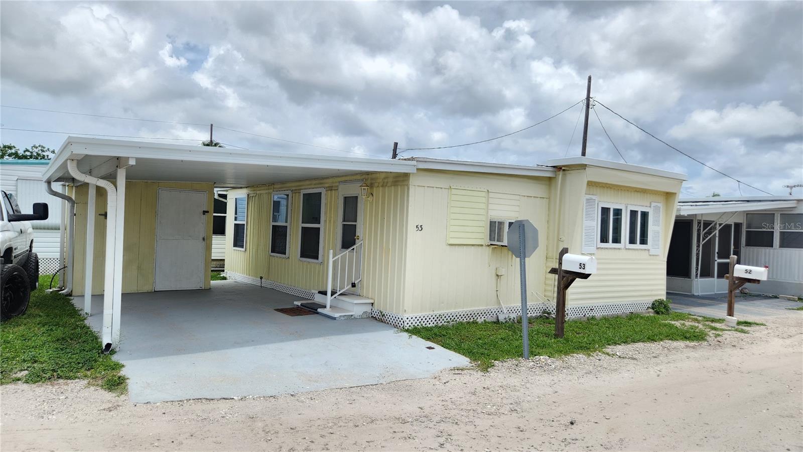 Welcome to Oasis Mobile Home Park, a hidden gem in a friendly, resident-owned 55+ community with NO LOT RENT! Included in the purchase price is your own land share, and the low HOA fee of just $143/month covers water, sewer, garbage, and lawn maintenance. Move right into this furnished 1-bedroom, 1-bathroom mobile home, which also features a bonus room currently used as an office. A convenient mudroom with a back entrance offers excellent potential as a utility or laundry room. This home is clean and bright with newer windows throughout. It has been tented for termites in July 2025 with a transferrable warranty, providing peace of mind for years to come. You’ll also enjoy the covered carport and storage shed on the desirable corner lot. The community offers great amenities including a clubhouse, laundry facilities, shuffleboard courts, and more. Located close to Largo Mall’s shopping and dining options, just 20 miles from Tampa International Airport, and only minutes from the beautiful Gulf Beaches, the location can’t be beat. Schedule your private showing today and start enjoying the Florida lifestyle!